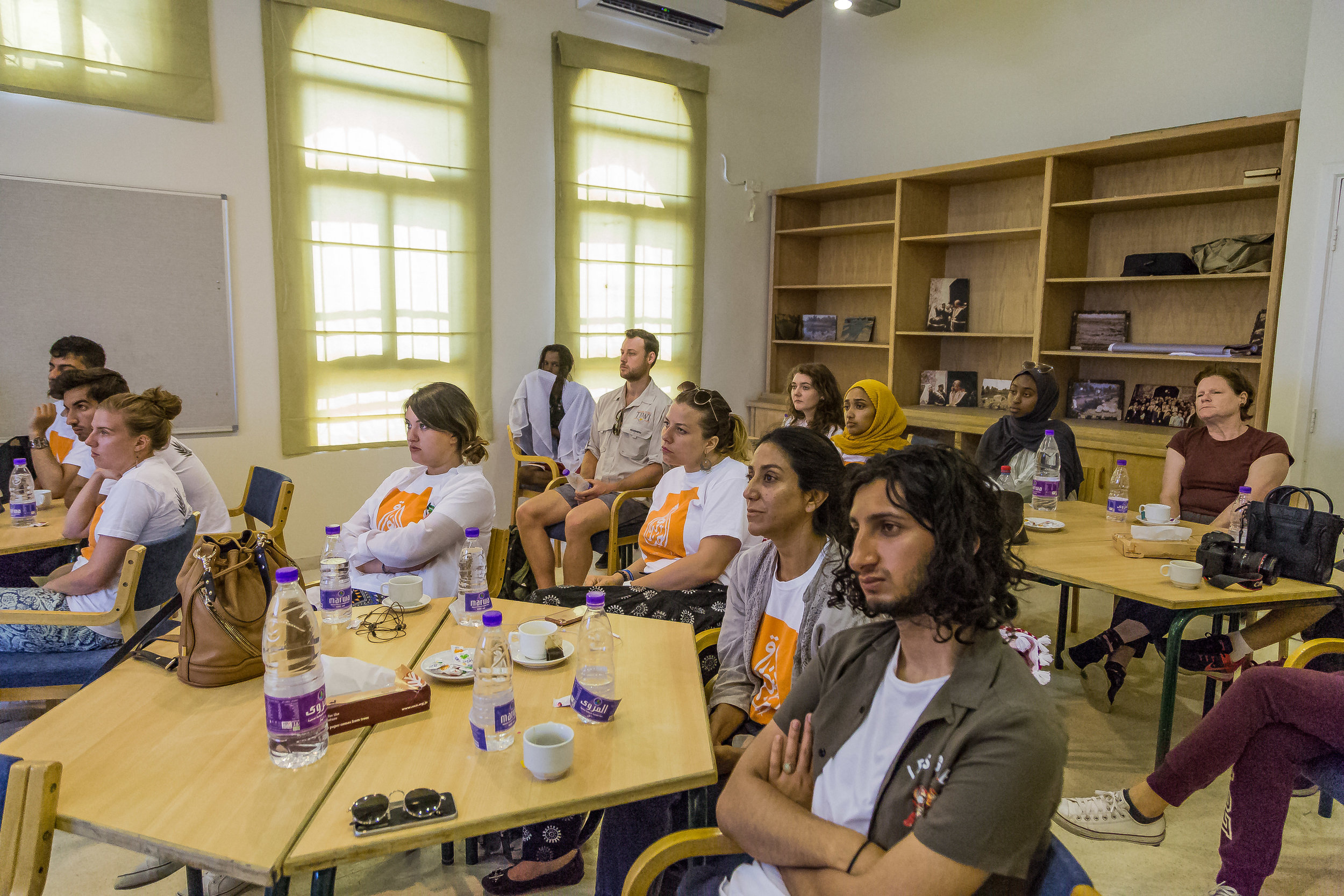 A Photograph of the students attentively listening to the environmental presentation the image by Rashad S Anabtaw