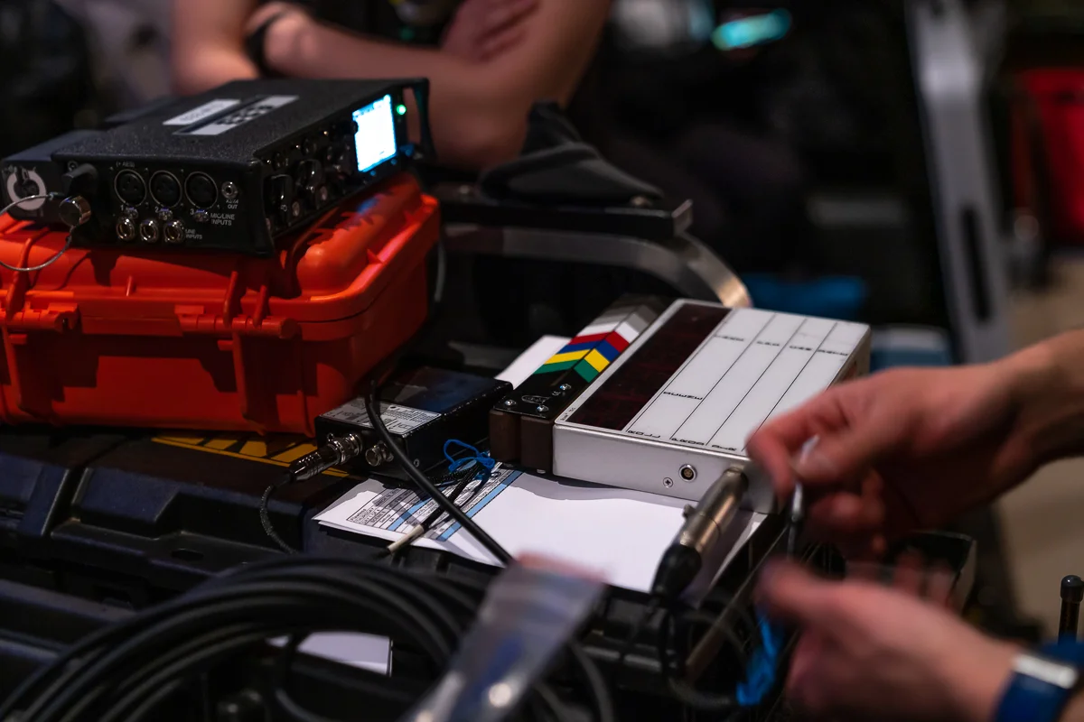 A unit Still Photograph by Chicago Set Photographer Rashad Anabtawiof the Sound Team setting up the Smart Slate