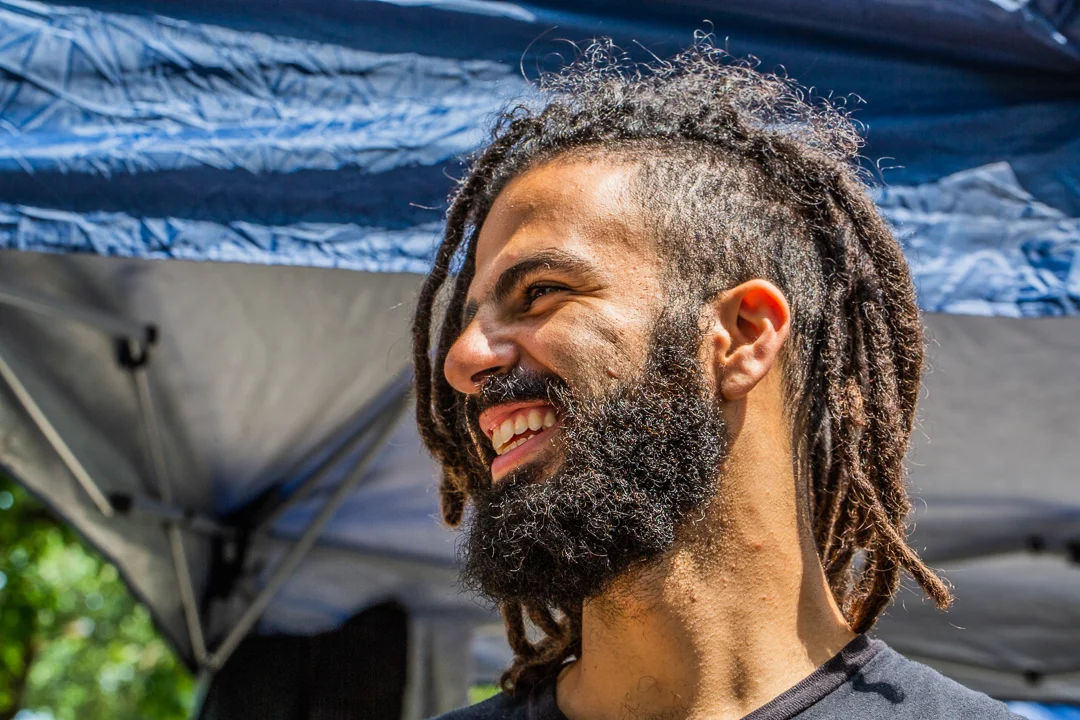 Unit Still Photograph by Chicago Set Photographer Rashad Anabtawi of a smiling crew Member