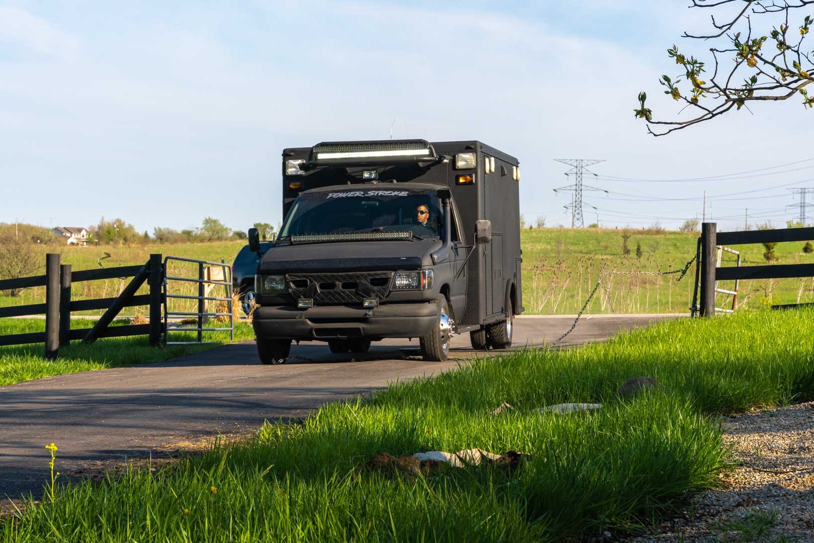 Production Still by Chicago set Photographer Rashad Anabtawi of the Van Busting through the Chain shot