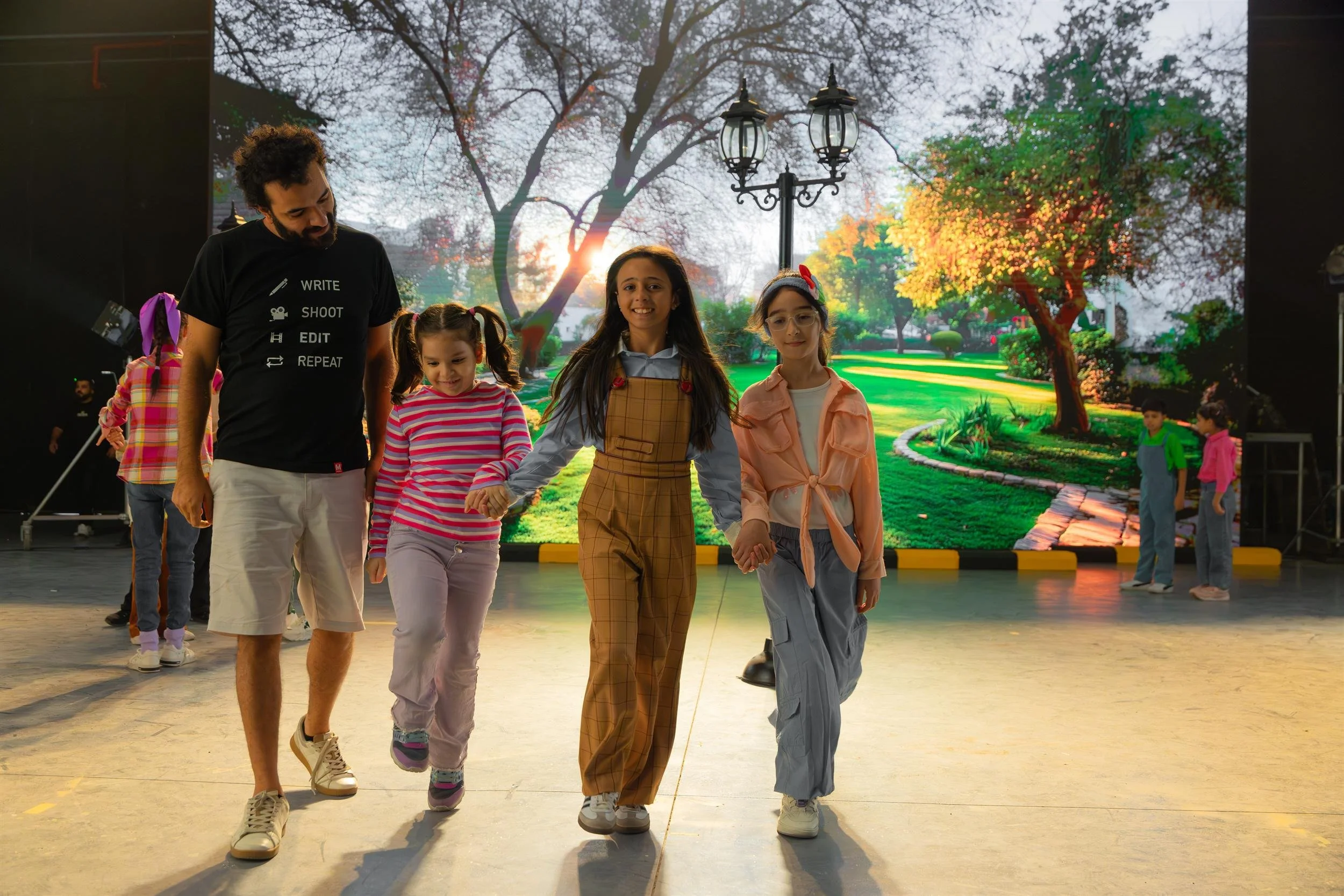 Ahlan Simsim unit still of children walking on the Olivewood Studios set