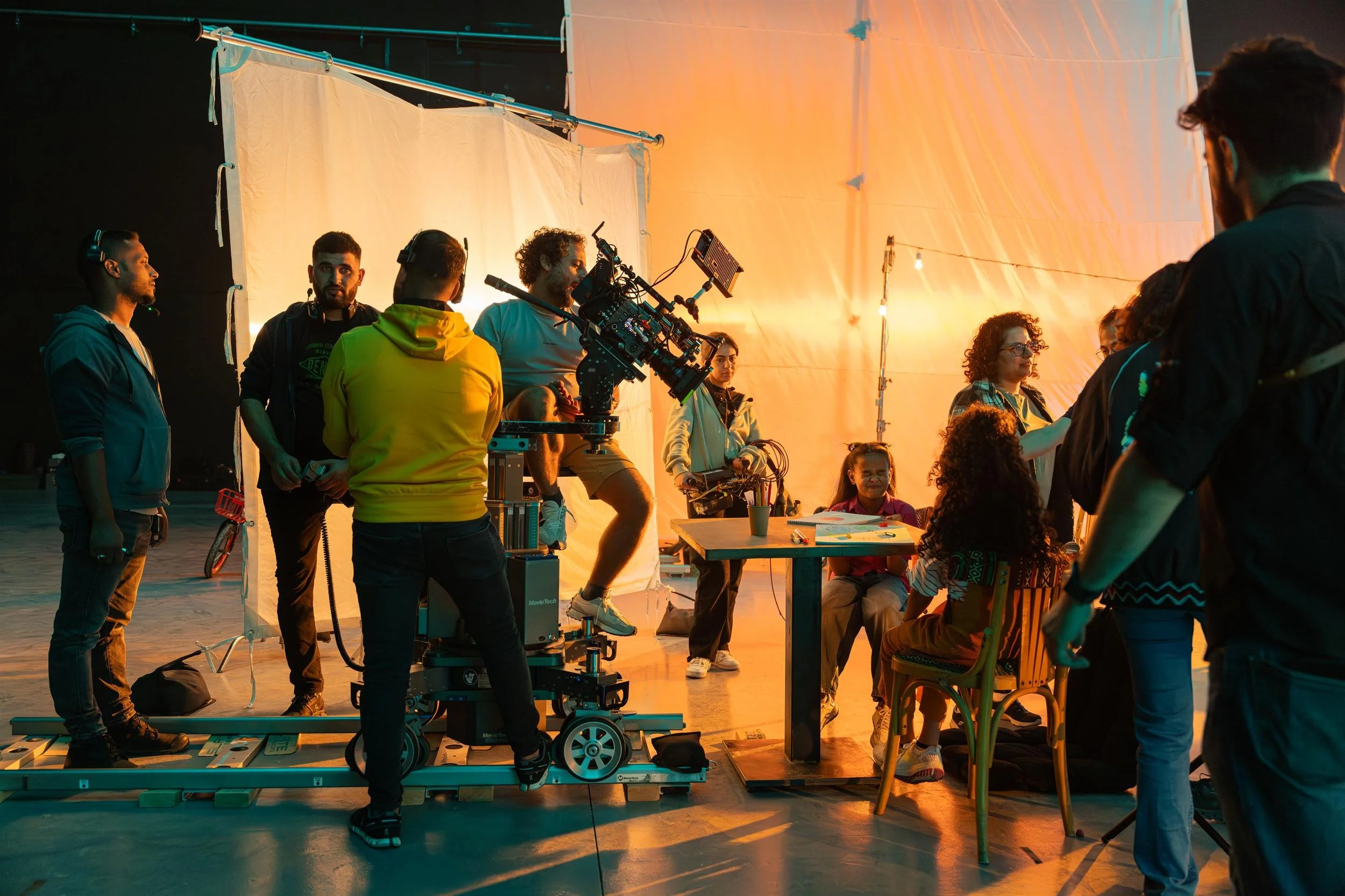 Ahlan Simsim unit still: A film crew shoots a scene on set.