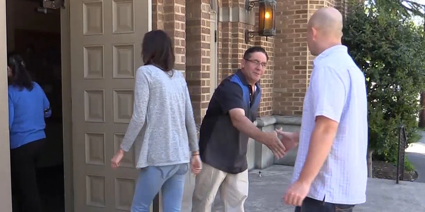 usher handshake in front of church.jpg