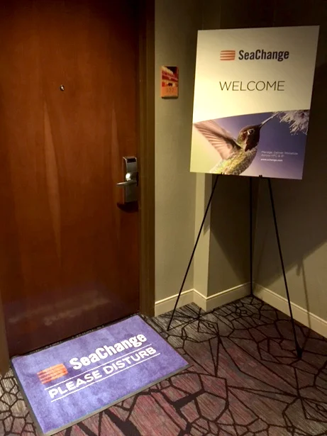     SeaChange doormat and sign outside a suite at NAB 2017 in Las Vegas.    