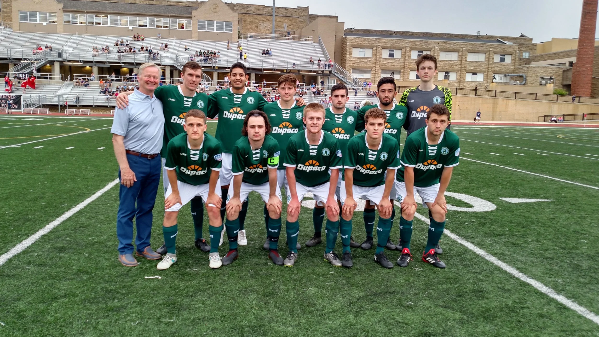 City of Dubuque Mayor Roy Buol joins the Union Dubuque starting squad on the field before the club's first-ever home match against the Des Moines Menace. 