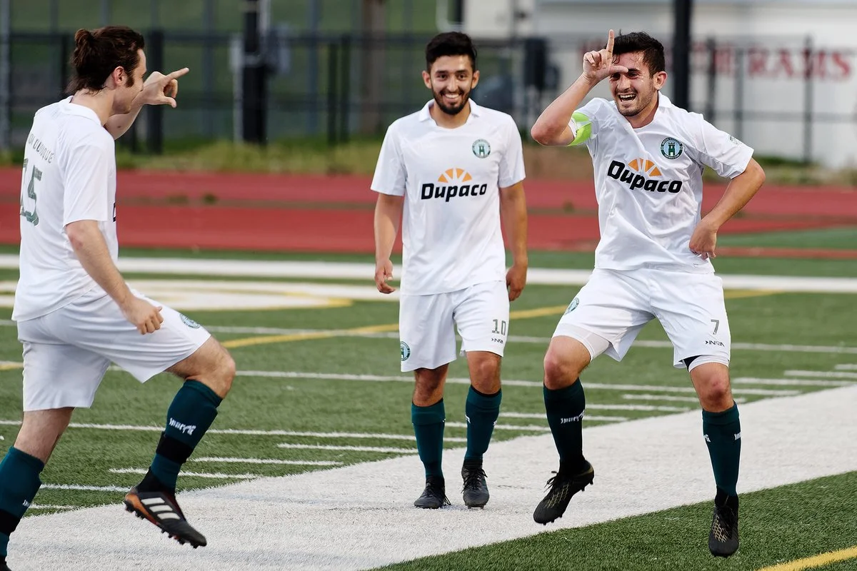 Ryan Pacholski and Raudel Fierro celebrate with goalscorer Alex Hererra. PC: Stephen Packer