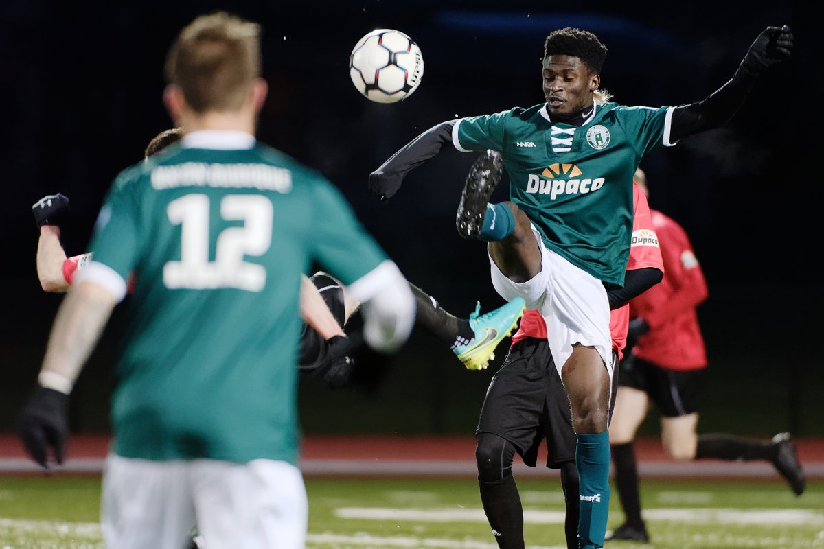 Union midfielder Patrick Asamoah battles for the ball in the air