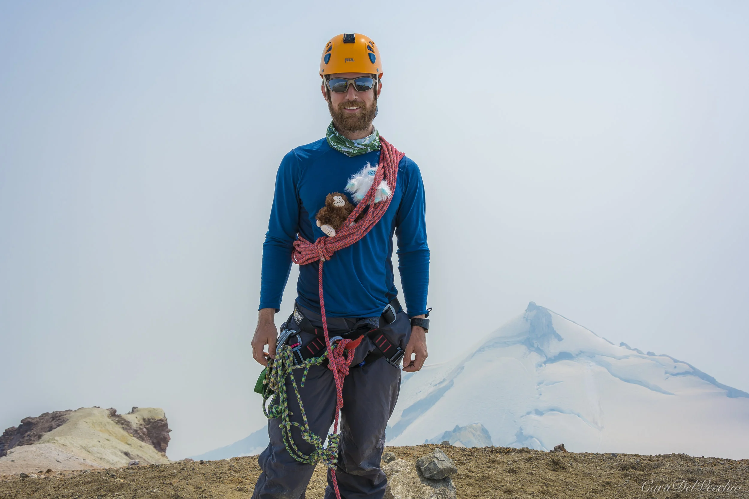 Adam on peak with Yeti and Sasquatch (friends of his kids!).