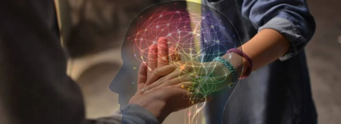 brain illustration over touching hands.jpg