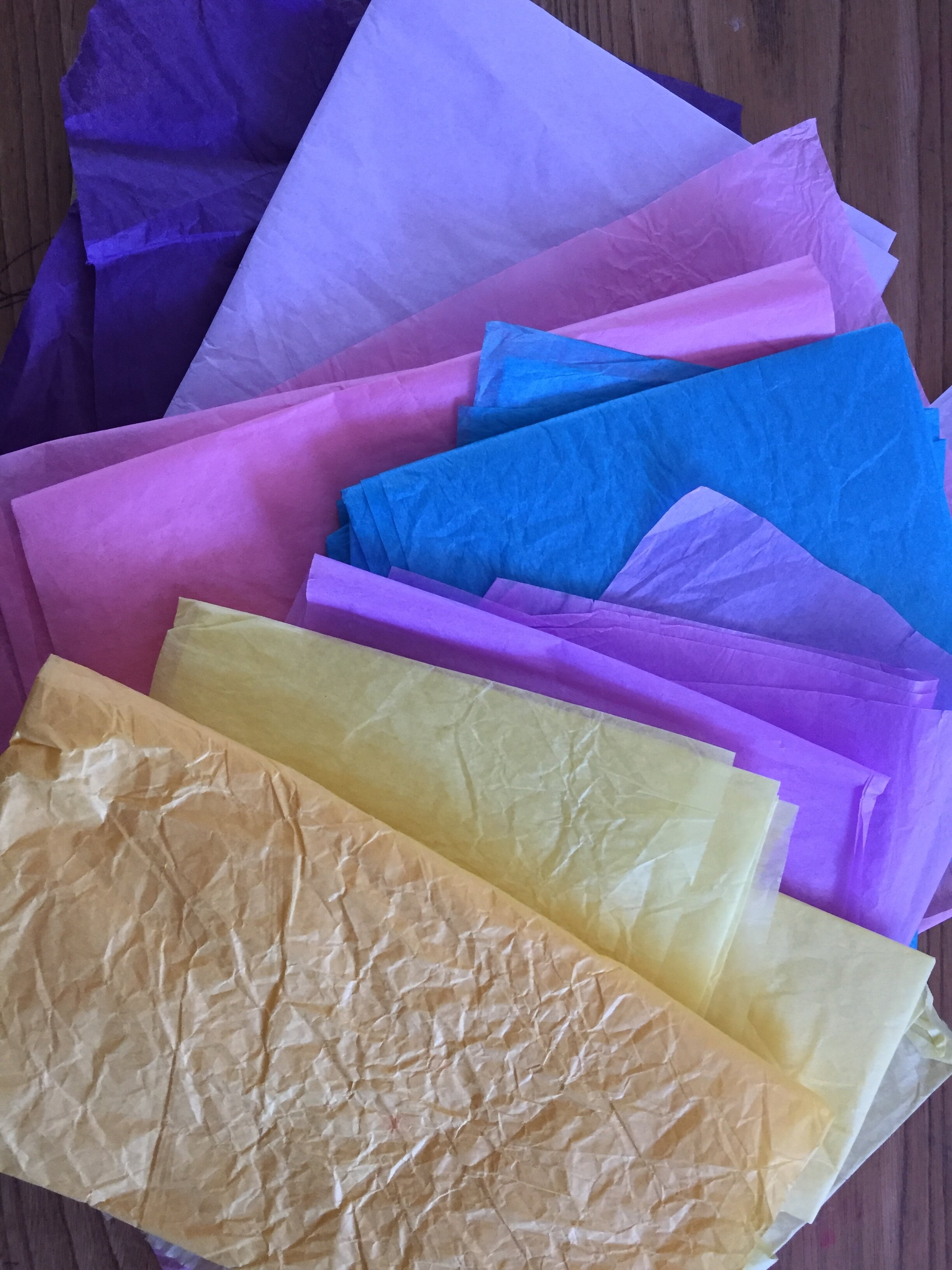 Gather as many different colours of tissue paper as you can. This is a great way to reuse old gift wrap!