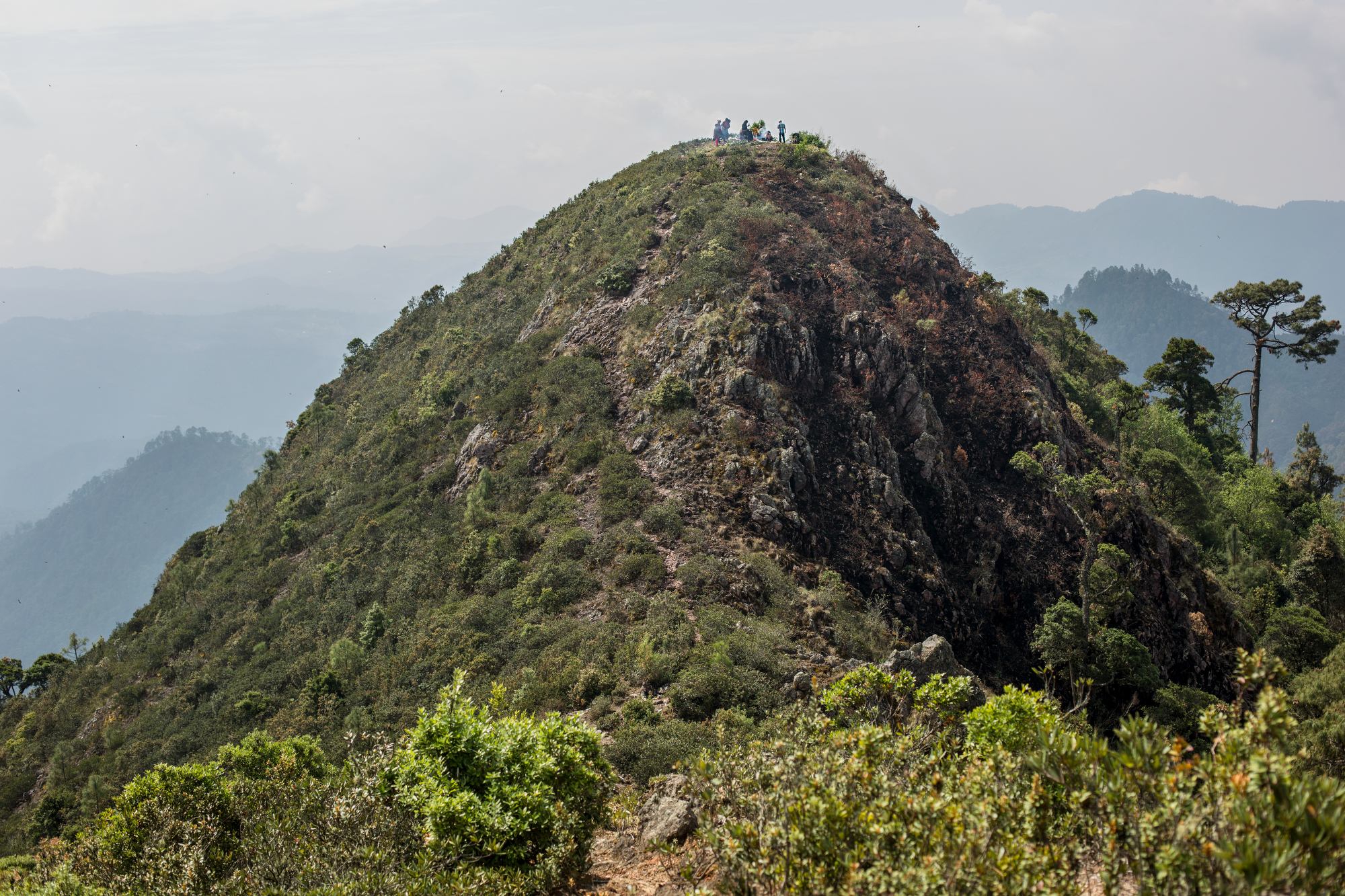 People gather atop a mountain to make a sacrifice, while participating in a rain ceremony in Cochoapa el Grande municipality, in the mountains of Guerrero, Mexico, April 24, 2016. This indigenous area is one of the most impoverished in Mexico and al