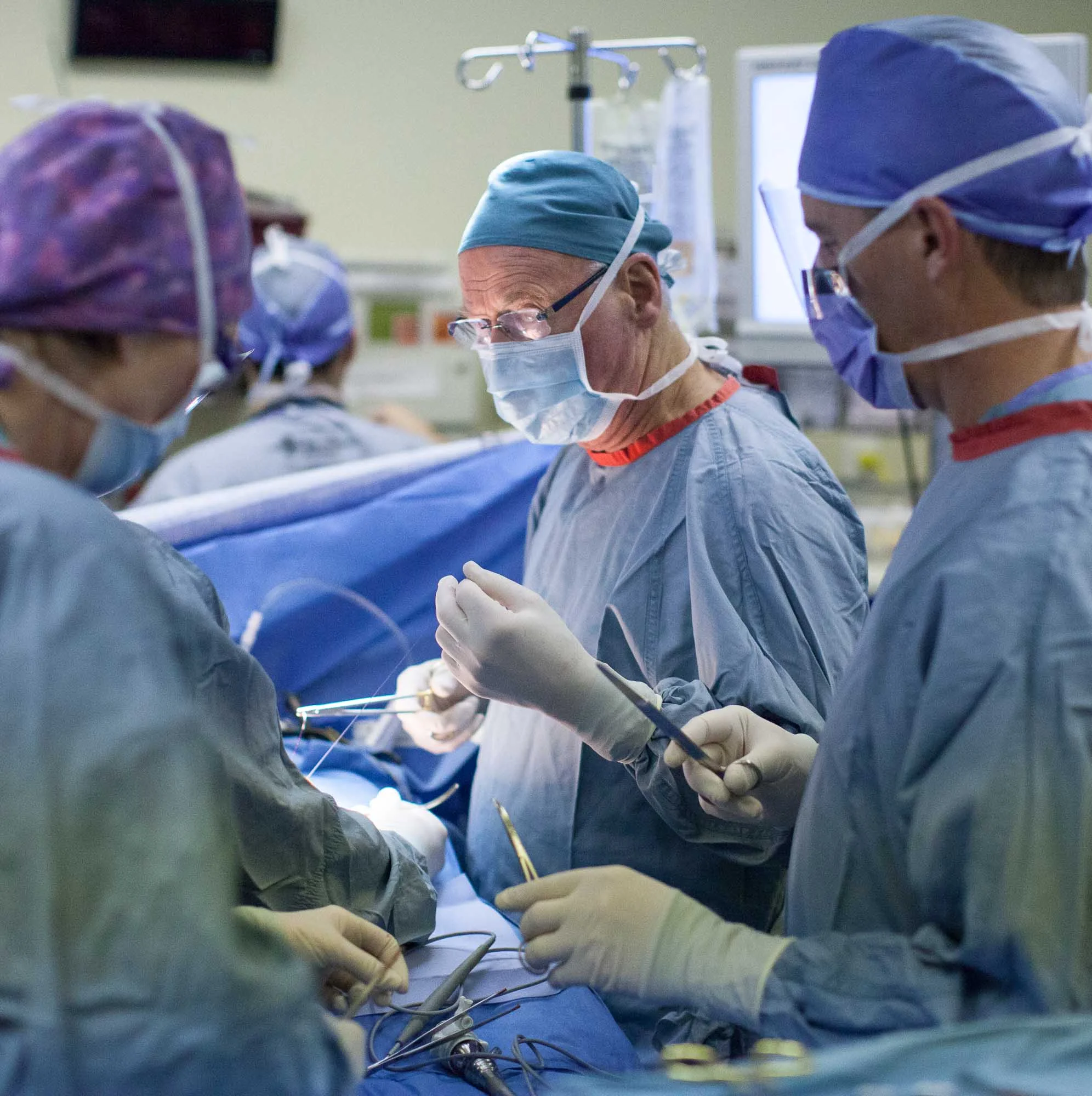 Dr. Sinclair Cox, middle, preps a patient for laparoscopic gallbladder surgery at Olds hospital in Olds, Alta. on Dec. 22, 2011.
