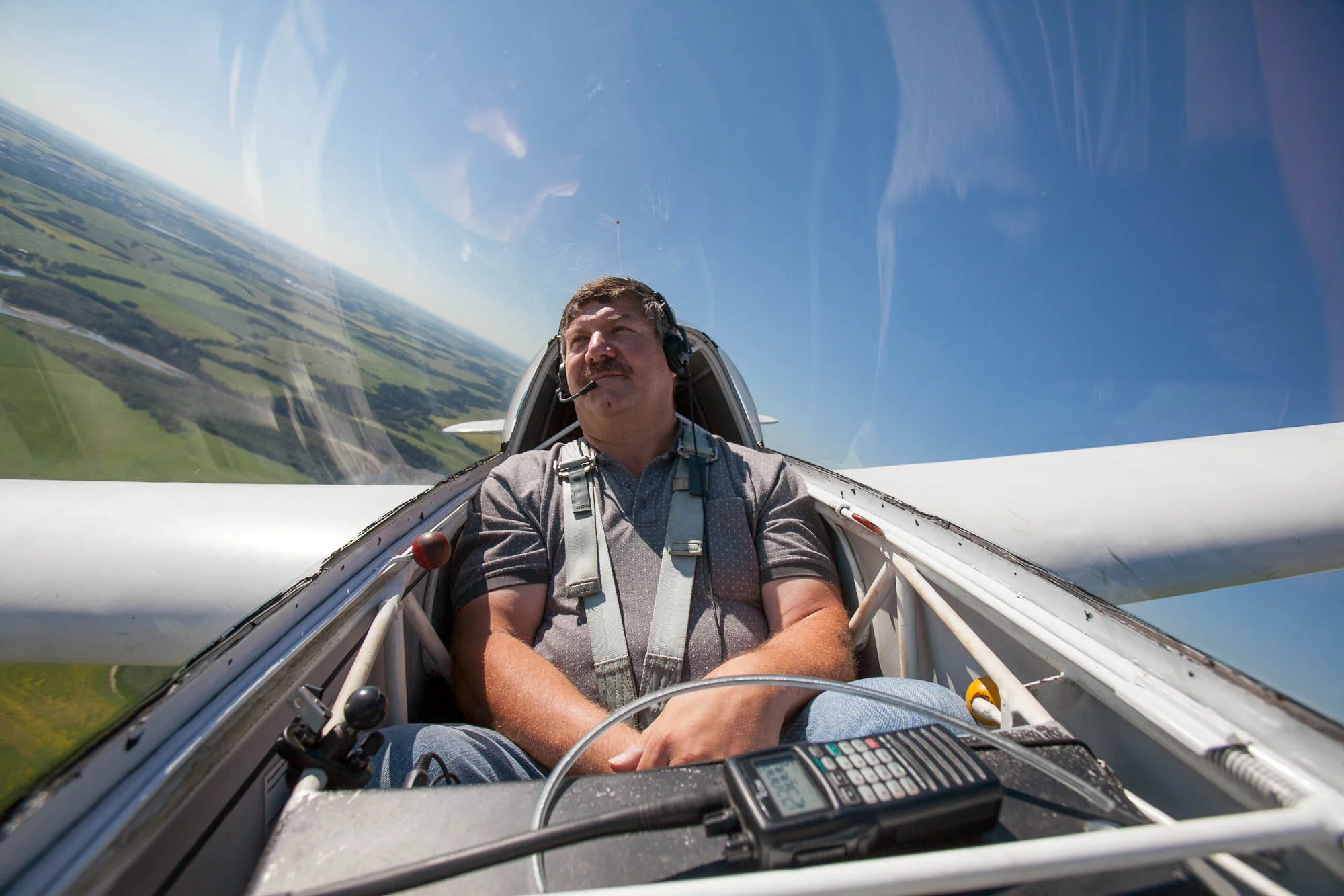 Pilot Leo Deschamps makes a turn while taking a glider for a tour around the Innisfail Airport just outside of Innisfail, Alta. on July 31, 2013.