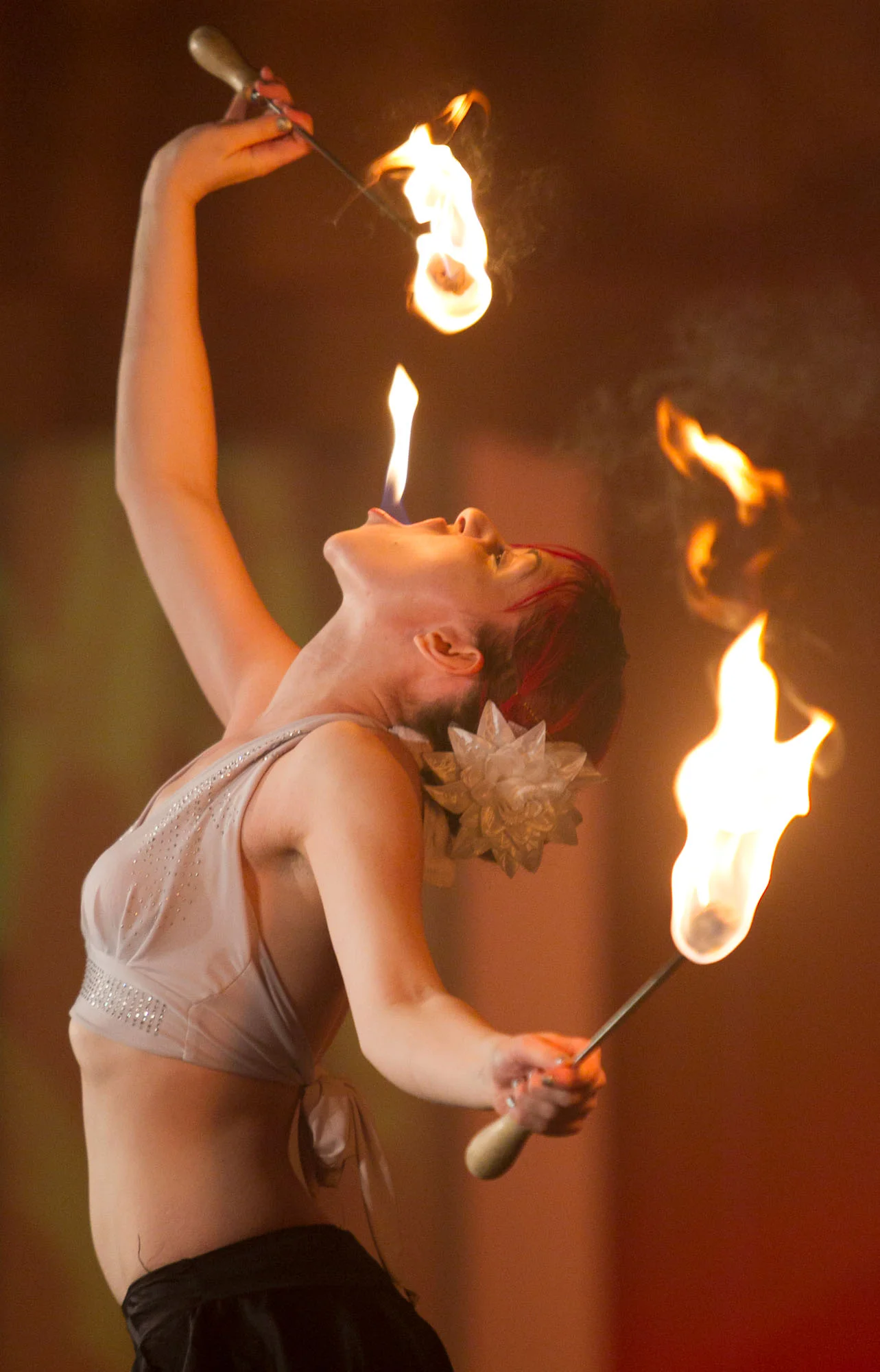 A member of Ballyhoo breathes fire during the group’s performance at the annual Olds College Gala at the Ralph Klein Centre in Olds, Alta. on March 21, 2014.