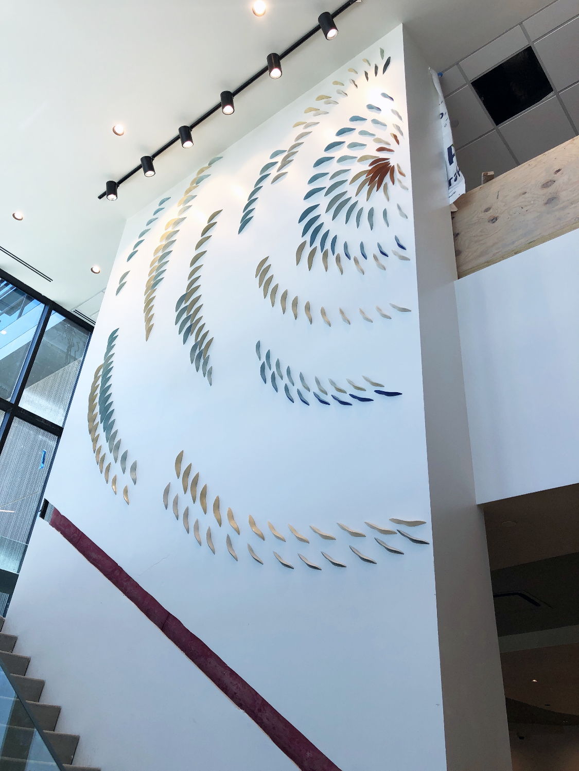 Cymatic wall looing up from stair.png