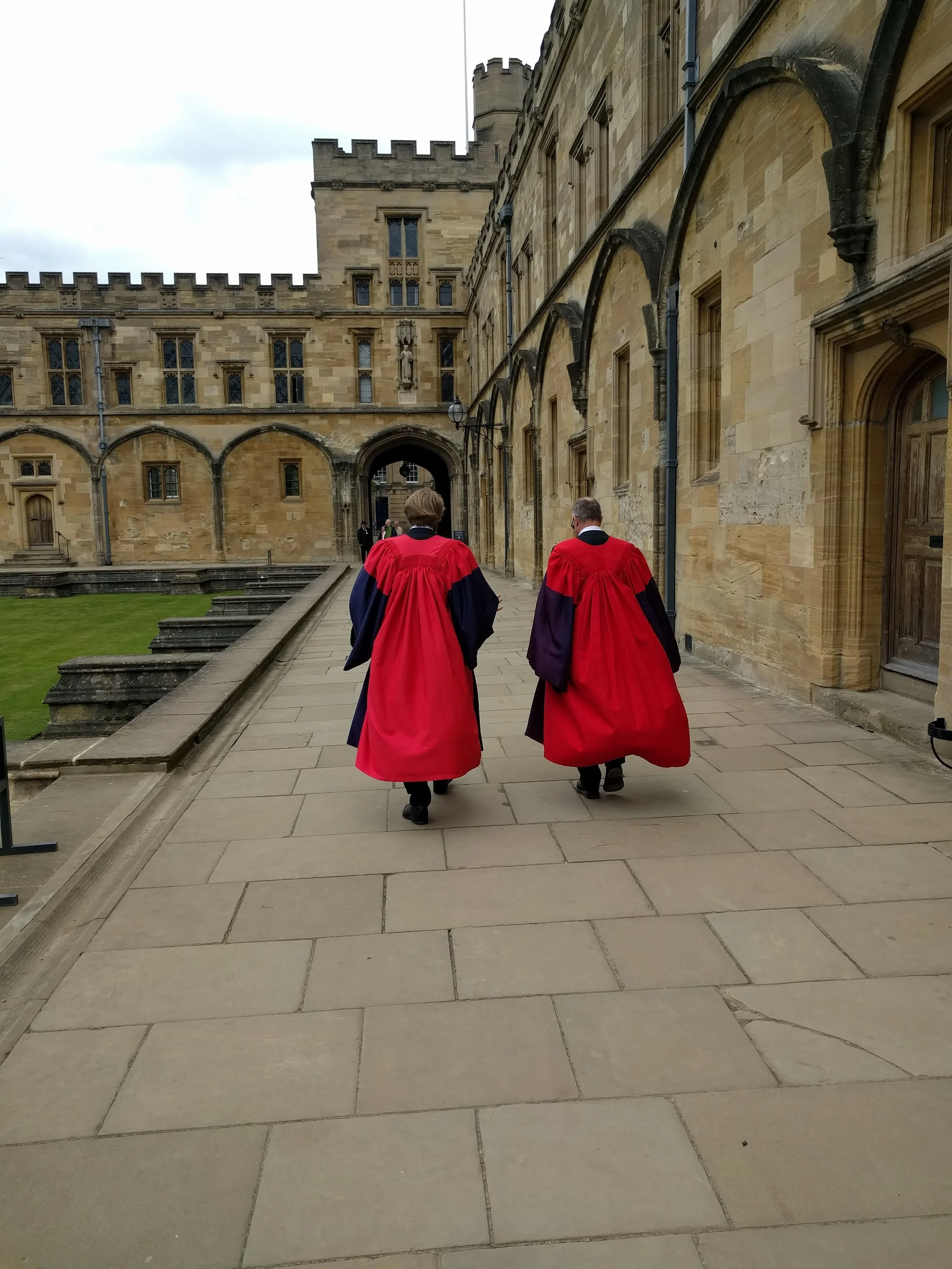 Father and son, donning the same cap and gown.