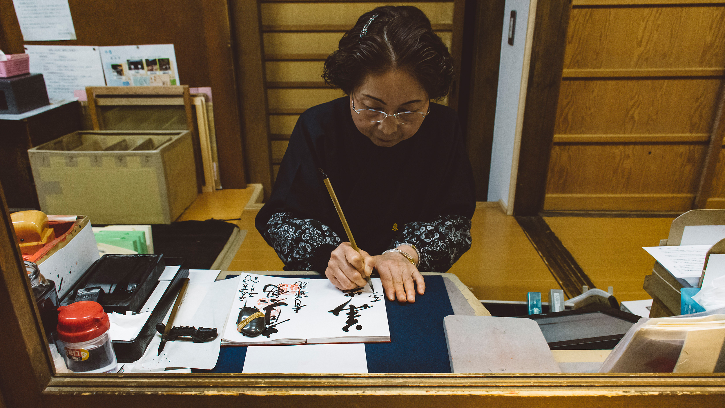 Todai-ji. Nara. Woman stamping my gushoin notebook.