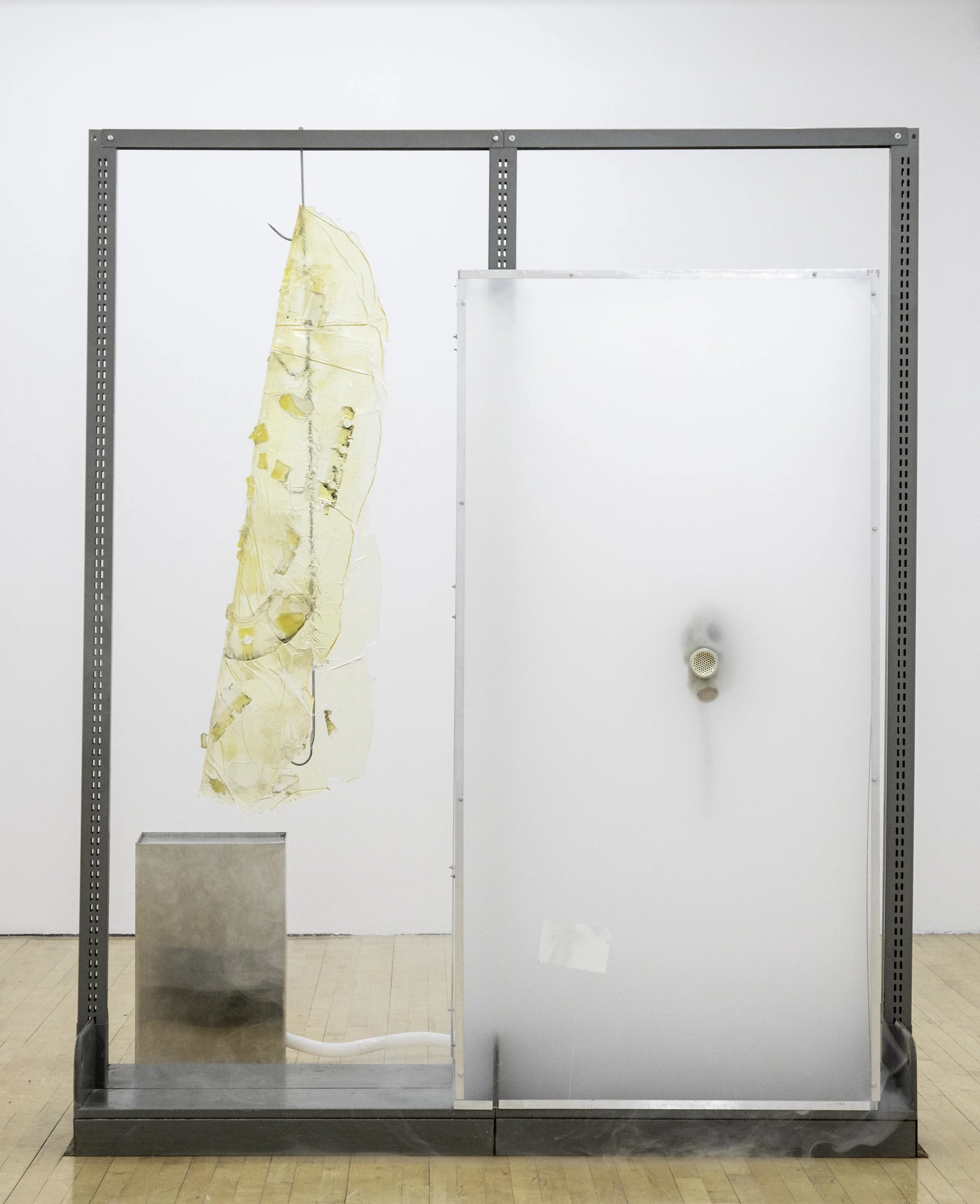 Vladislav Markov Untitled , 2018 library shelves, Plexiglas, polyurethane engine cast, gas mask, fog machine, plastic hose, self-adhesive carpet protector film 84 x 84 x 24 inches (213 x 213 x 61 cm) (VM3)