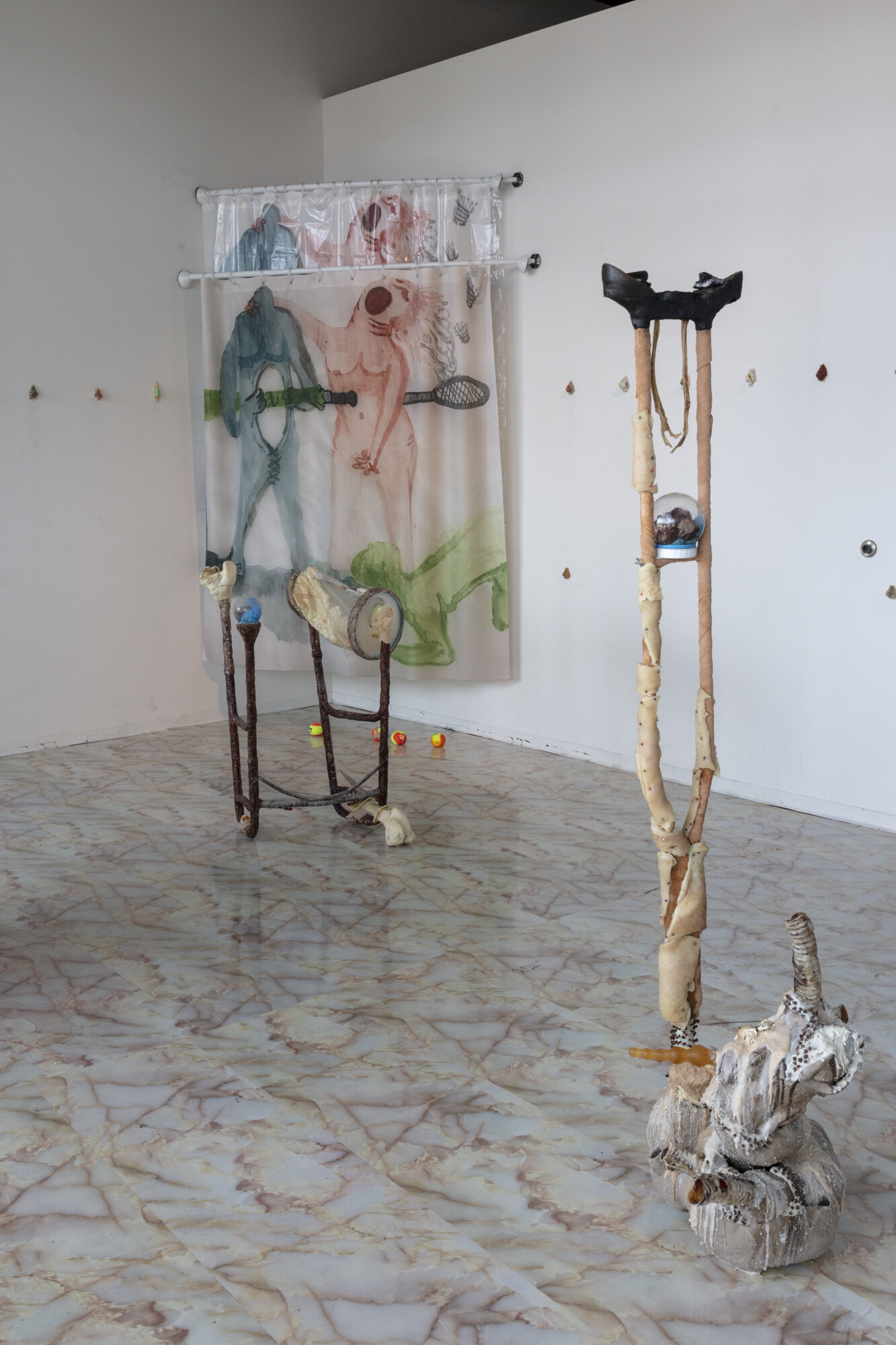  Lauren Lee  (pit-a-pat) stabbing myself thru and through with a well-bruised banana , 2019 (installation view) Water color drawings, shower curtains, shower curtain rods, paraffin wax, doe urine, sheep's placenta, used walker, used crutch, epoxy cla