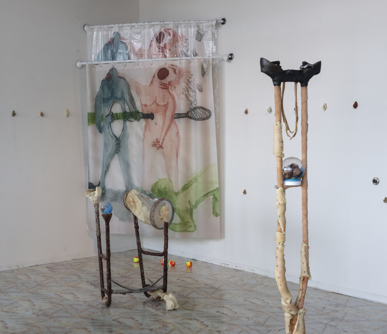  Lauren Lee  (pit-a-pat) stabbing myself thru and through with a well-bruised banana , 2019 (installation view) Water color drawings, shower curtains, shower curtain rods, paraffin wax, doe urine, sheep's placenta, used walker, used crutch, epoxy cla