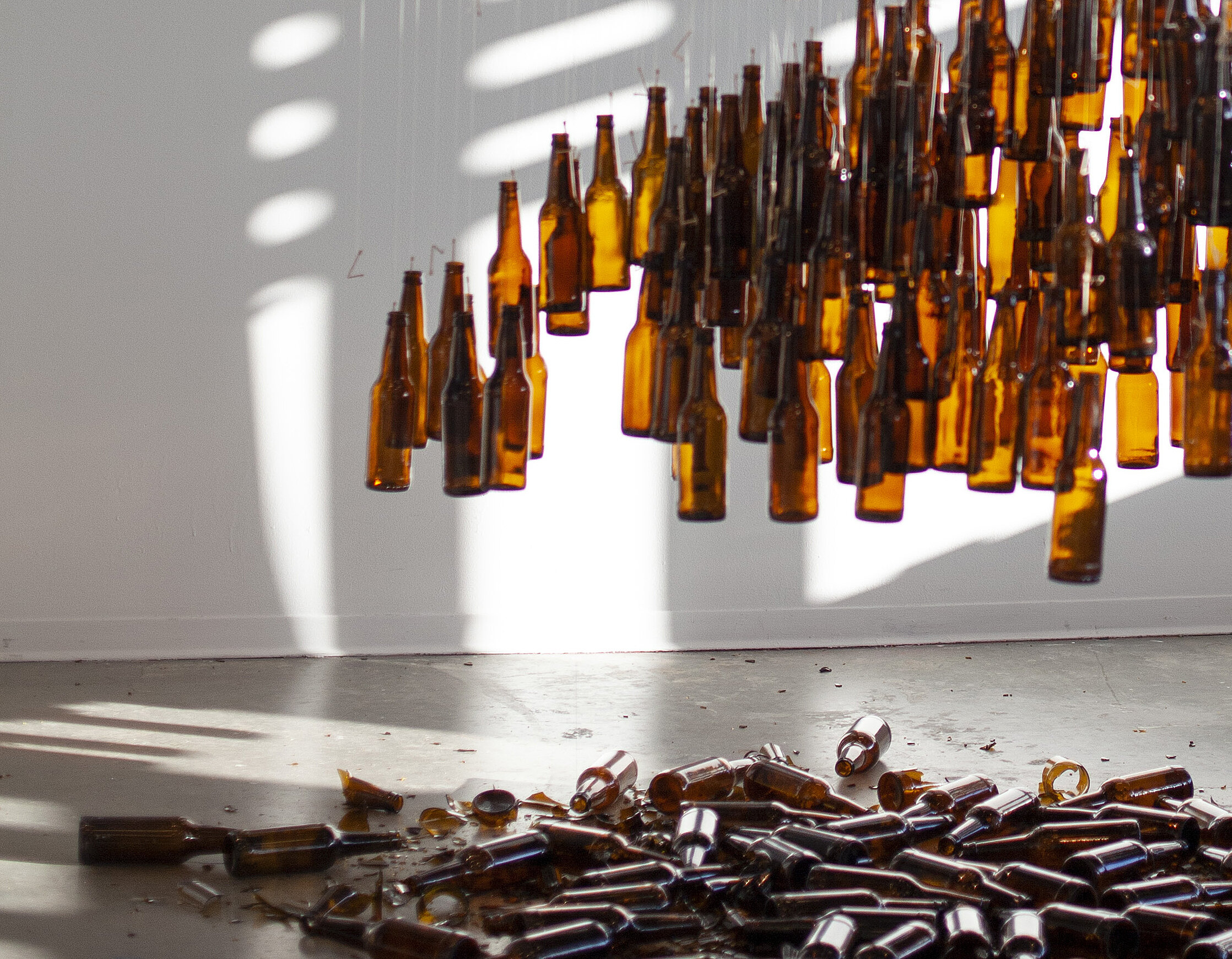  Anna Miller  HOURGLASS , 2019 Toothpicks, beer bottles, thread, wood, rope 180 x 108 inches (457 x 274 cm) 