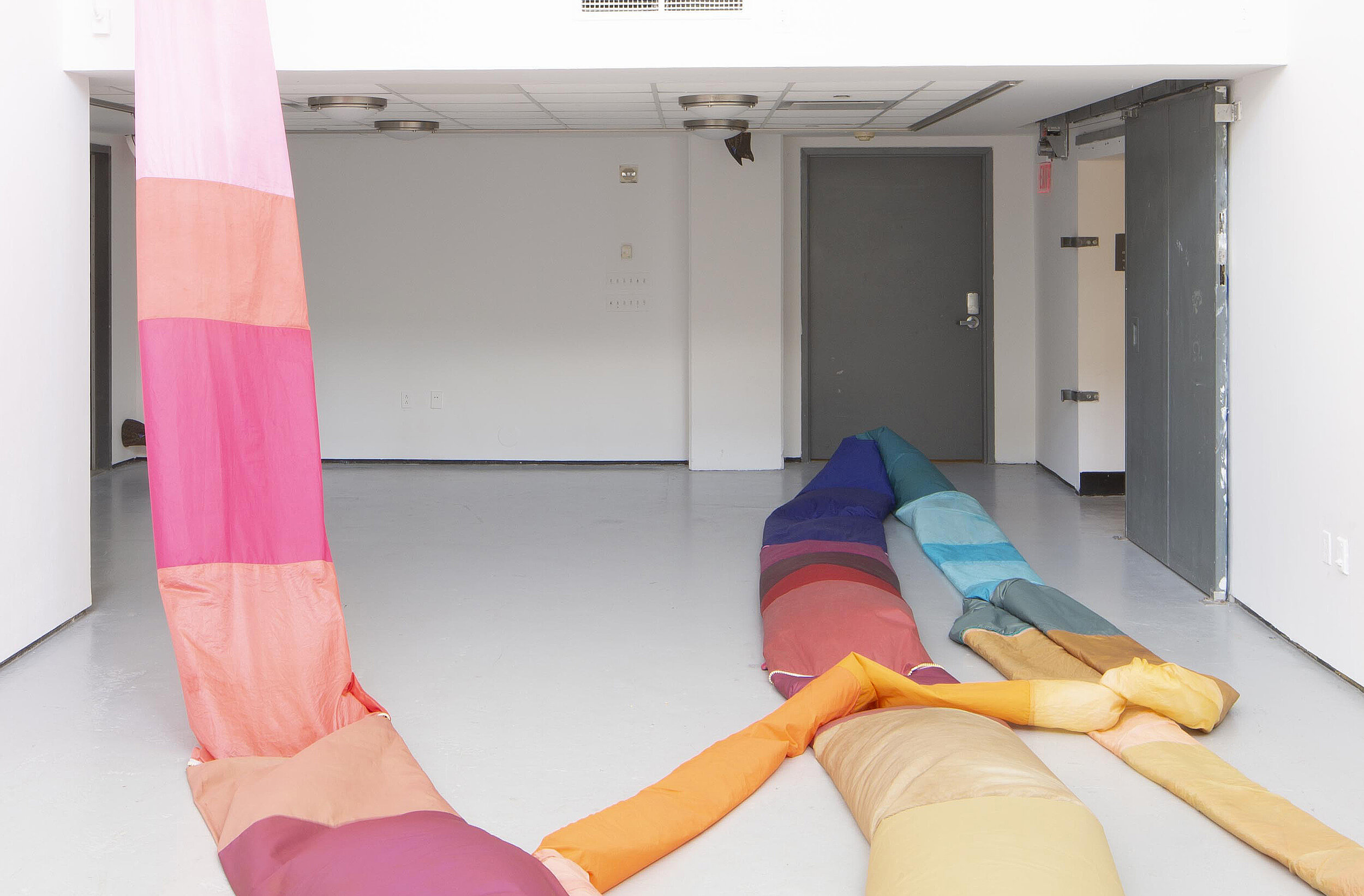  Peyton Peyton  Labber Rinse Repeat , 2020 (decoy duck butt placement) thread, acid-dyed nylon, plastic tarp, zippers, elastic, velcro, staples,  clear vinyl, air blowers, interval timers, decoy duck butts, cushion dimensions variable to installation