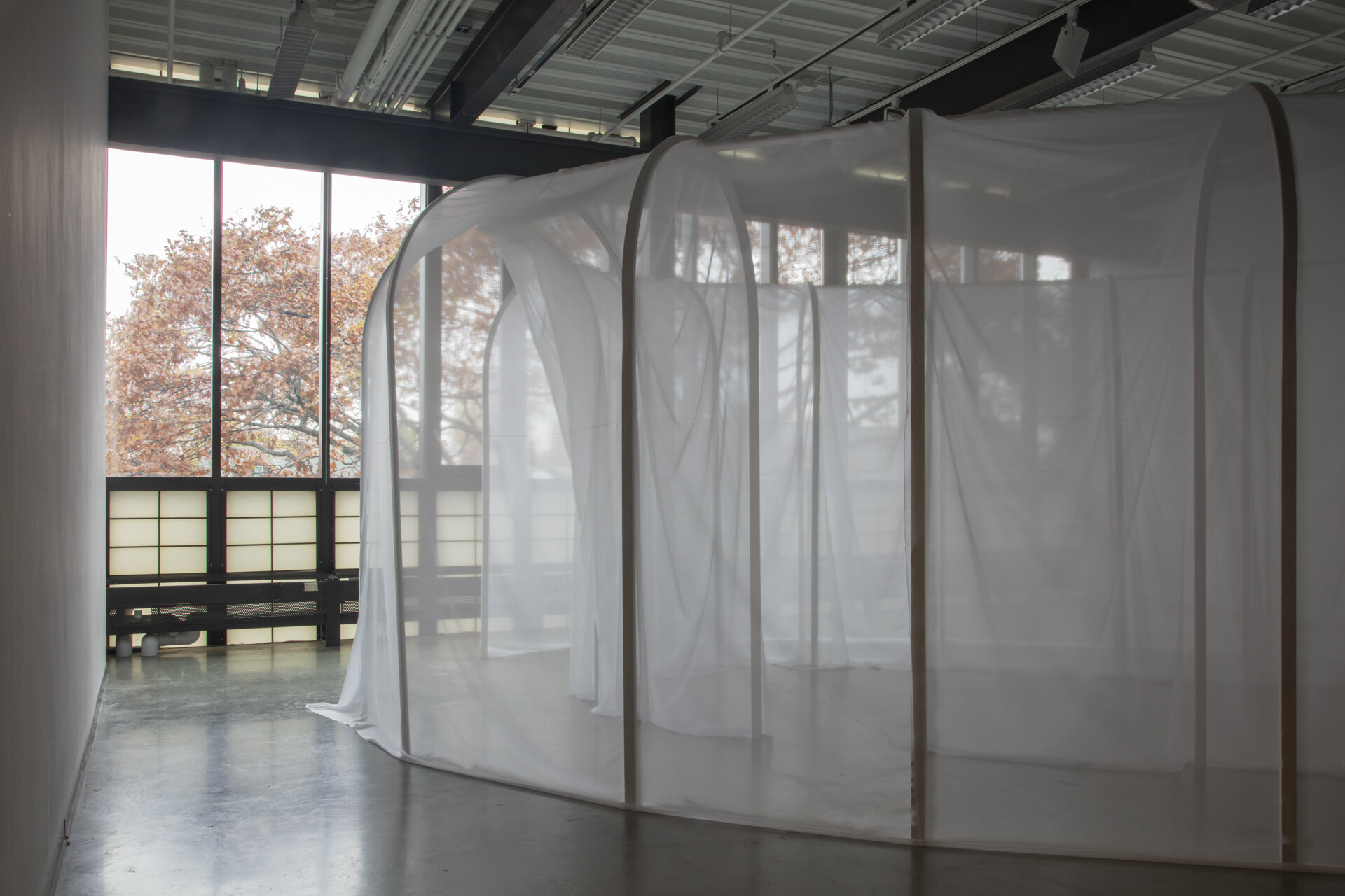  Randi Renate  and here I dreamt, in a subaqueous state, that we had no bodies , 2018  high theatrical scrim, hardwood, wax, straight pins, hardware 177 x 106 x 233 inches (450 x 270 x 600 cm) 