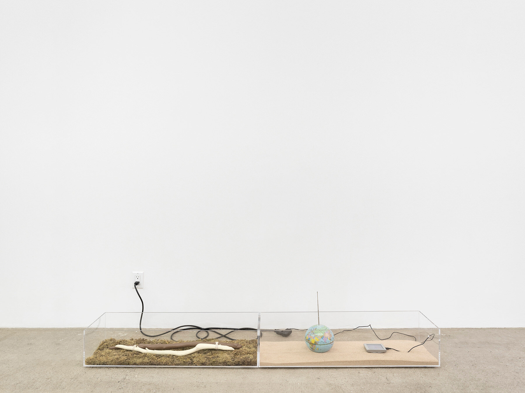  Connor McNicholas  The Meaning of a Word is a Bunch of Other Words , 2020 Plexiglass, Polyamide, GPS, moss, sand, globe,  antenna, stone, cables, electricity 9 x 68 x 10 inches (23 x 173 x 25 cm) 