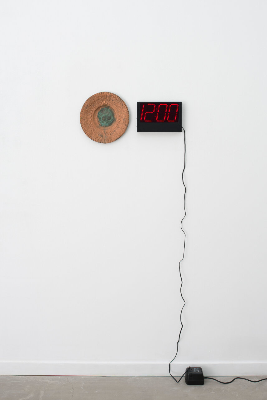  Connor McNicholas  Perfect Lovers , 2020 Copper Aztec calendar, digital clock, electricity, hardware 24 x 12 inches (60.96 x 30.48 cm) 