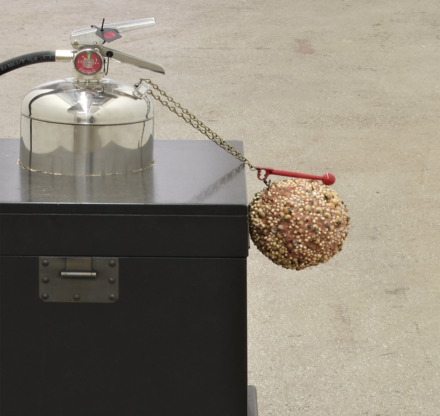  Kevin Hernández Rosa  Lightning for for , 2021 (detail) metal case, type A fire extinguisher filled with Drano, glass breaking hammer,  HDPE, Christmas ornament, Utz cheese balls, red dye, black ink, glitter, epoxy 27 x 18 x 25 inches (69 x 46 x 64 