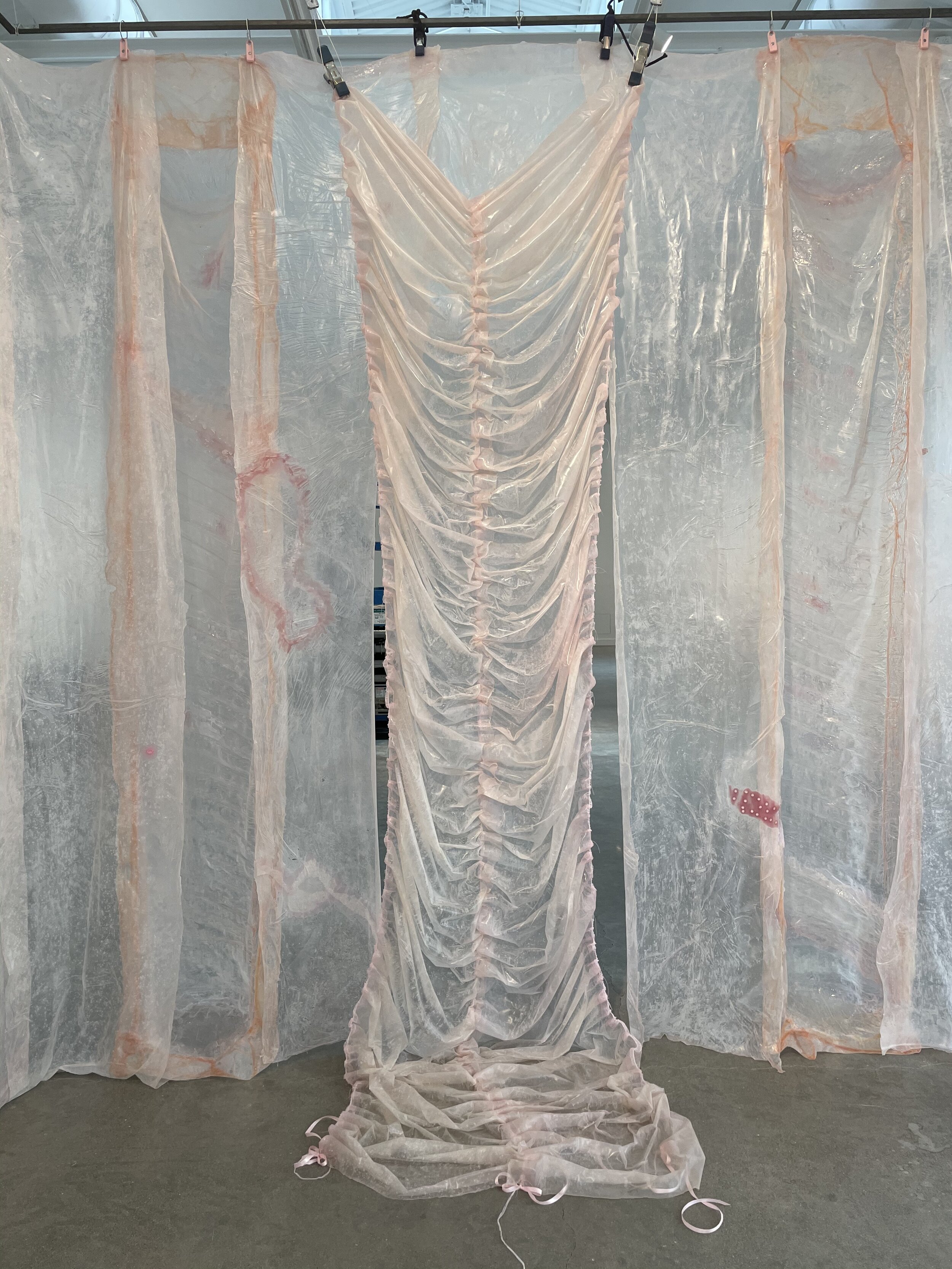  Karinne Smith  Pinky II , 2021  collagen film, flesh clamps, found bees, falsies, silicone, hair ties, baby powder, glass beads, found photograph, tulle dimensions variable to installation Installation view from ArtYard's inaugural exhibition  Girl 