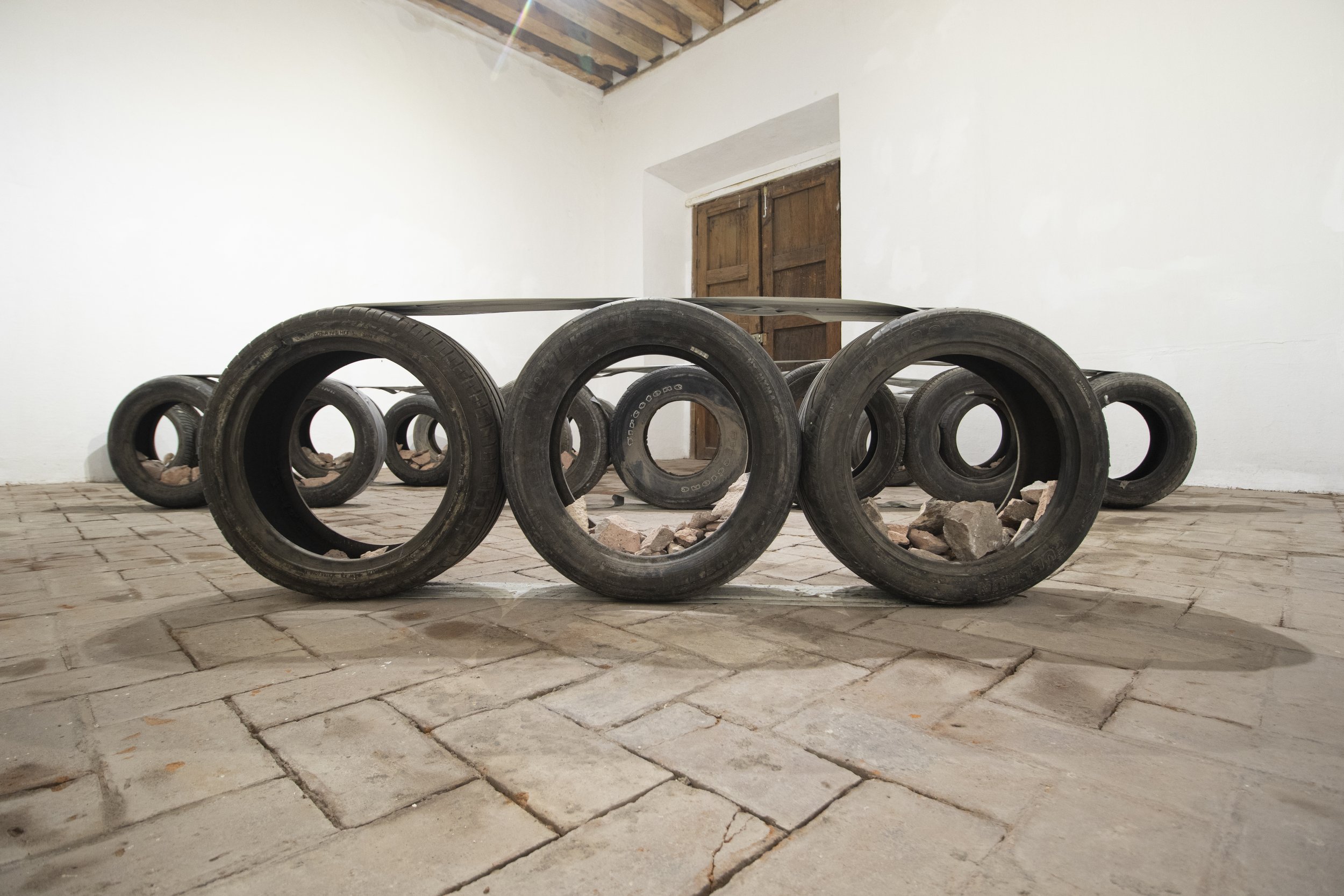  Bat-Ami Rivlin  Untitled (duct tape, duct tape, duct tape, tires) , 2022 tires, duct tape, found bricks dimensions variable to installation BR47 