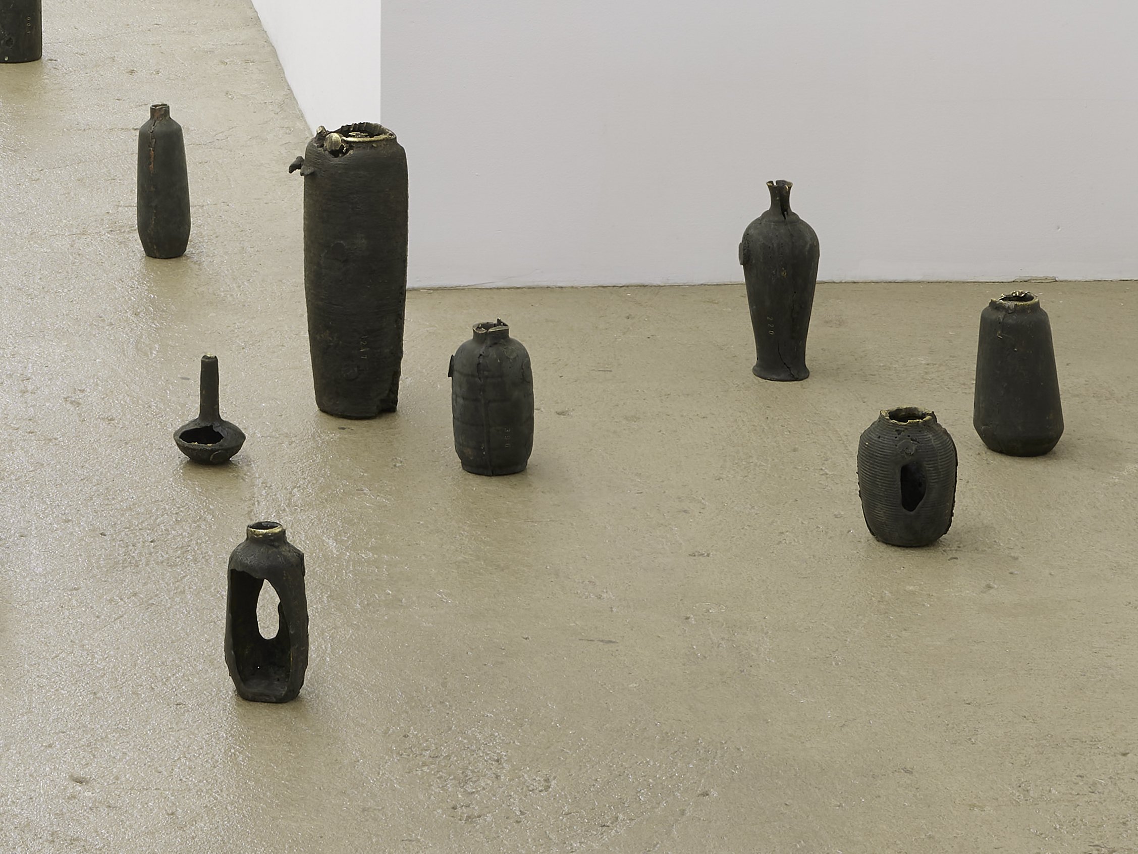  Sean Donovan titles vary, 2022 8 of 17 urns sand-cast from 74 up to 1,247 AR-15 rifle ammunition casings, patina each stamped and titled with the number of brass casings used in its casting 4.5 x 3.5 inches (12 x 9 cm) up to 12.25 x 5 inches (31 x 1