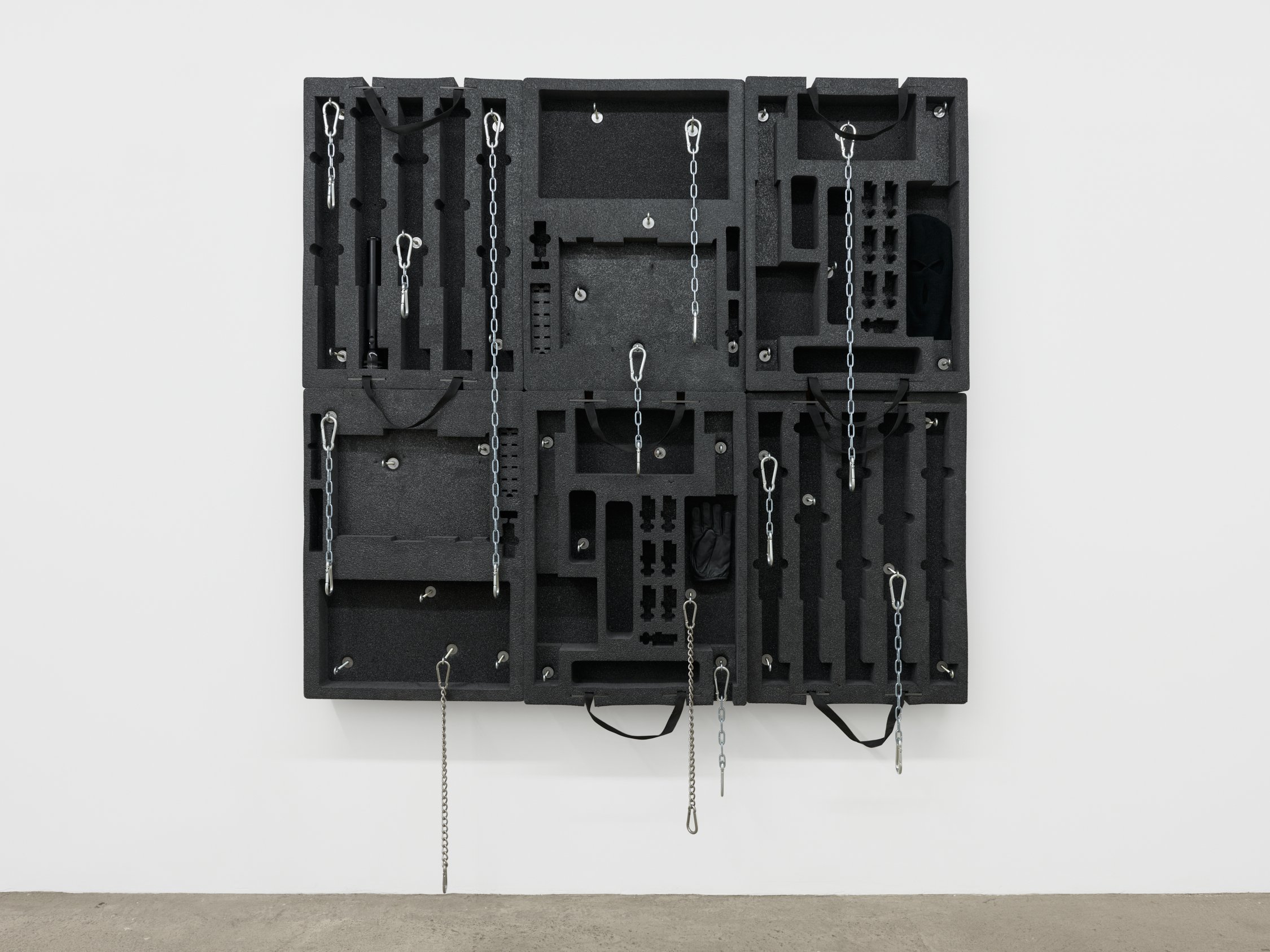 Joe Bartram  Constellation , 2022 Pelican case inserts, stainless steel chain, snap links,  miscellaneous hardware, wood, ski mask, Maglite, leather glove 72 x 68 x 8 inches (183 x 173 x 20 cm) JB2 