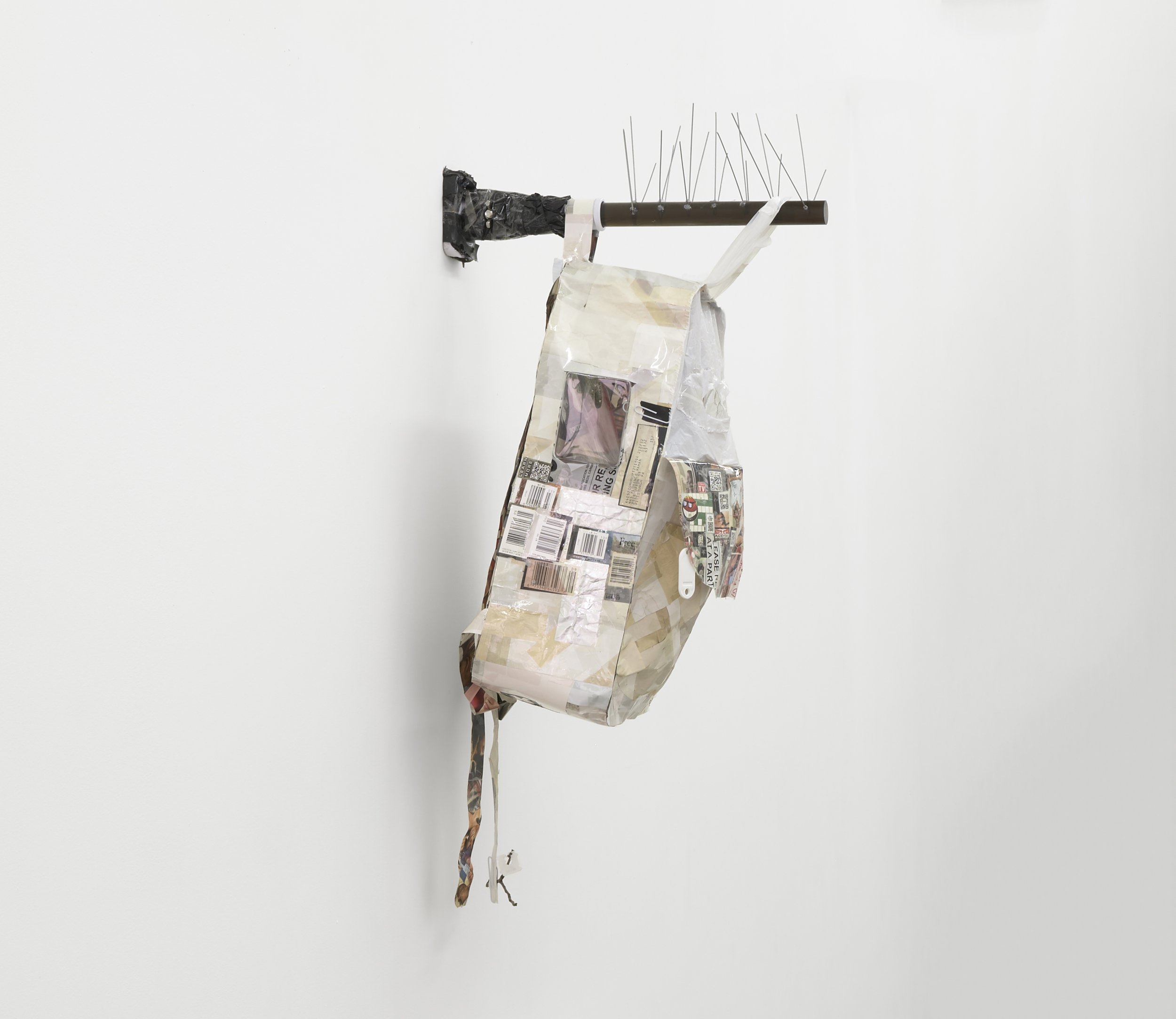  Elzie Williams III  Do You Know Where You're Going To? , 2023 magazine swatches of black and brown faces with the color white on reverse,  found images, plastic, found objects, acrylic rod, metal, flagpole bracket, light  33 x 14 x 12 inches (84 x 3