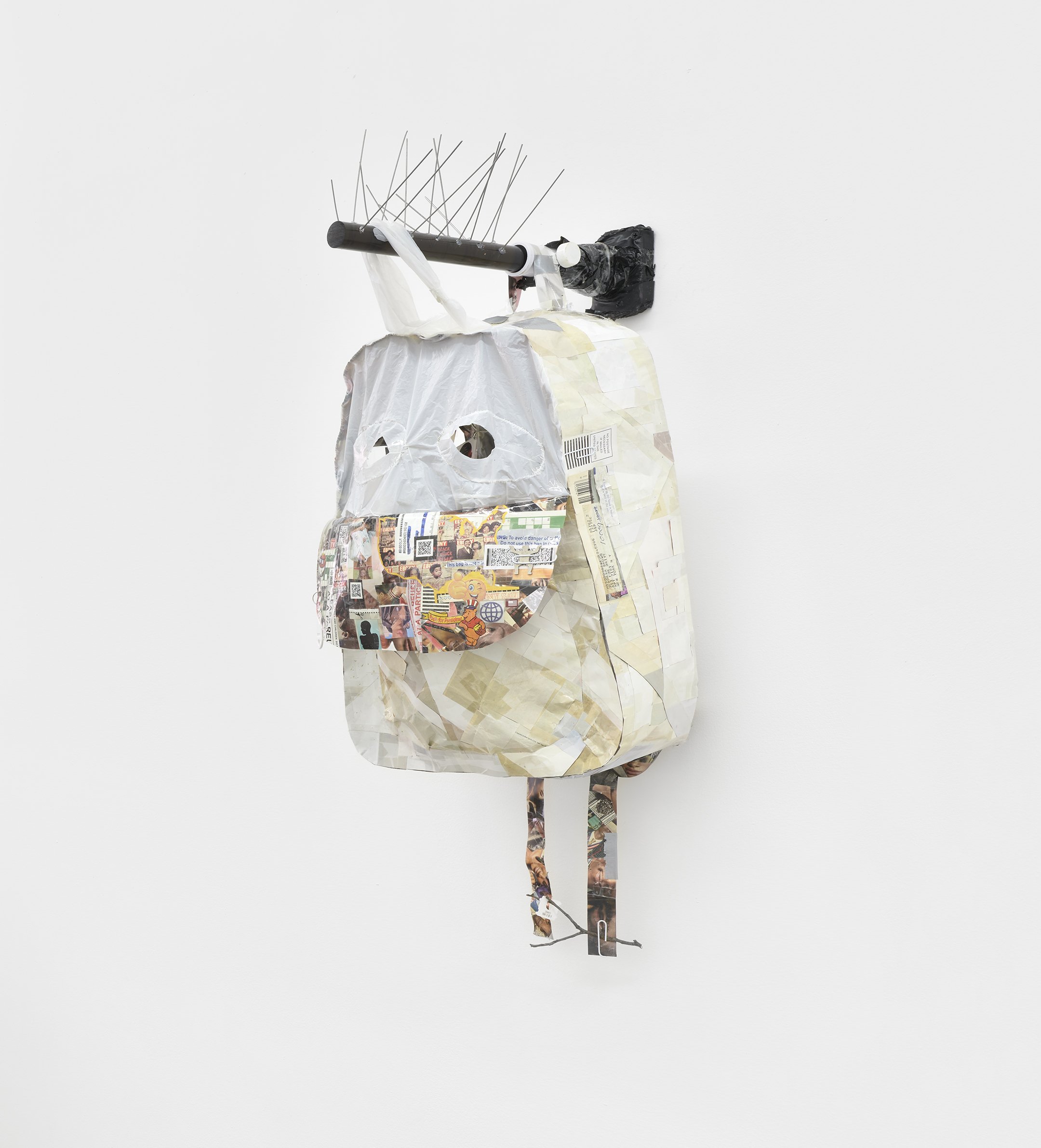  Elzie Williams III  Do You Know Where You're Going To? , 2023 magazine swatches of black and brown faces with the color white on reverse,  found images, plastic, found objects, acrylic rod, metal, flagpole bracket, light  33 x 14 x 12 inches (84 x 3