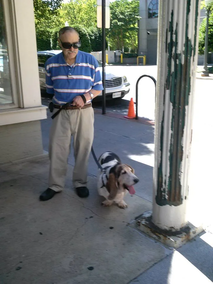 Senior home care client walking his basset hound dog in Roanoke, VA