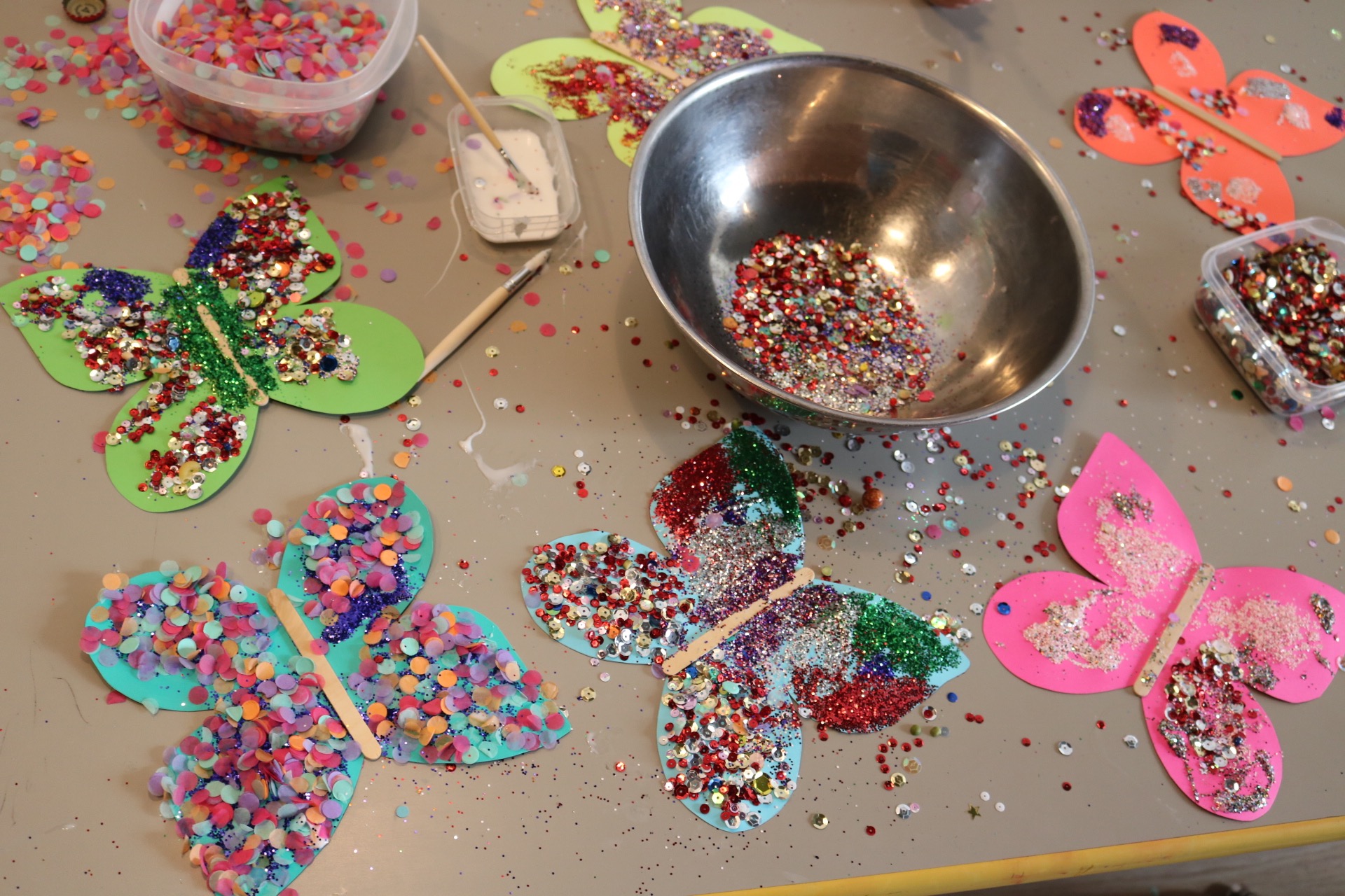 Group Project: Pollinators! We made butterflies to pollinate the flowers on our exploration wall!