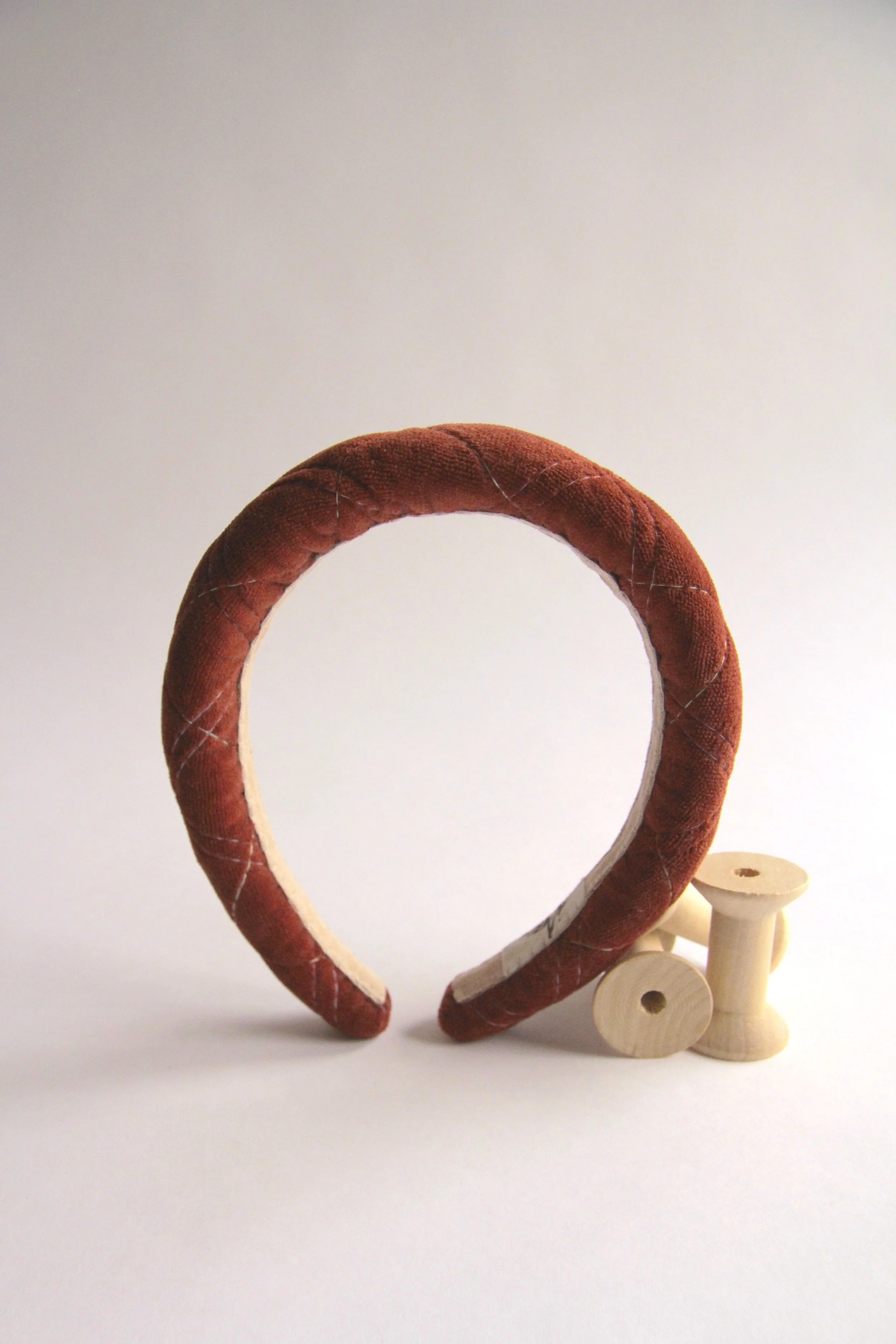 Hand-made dark copper Quilted velvet headband with sage and lilac stitching. Filled with organic cotton padding to add volume