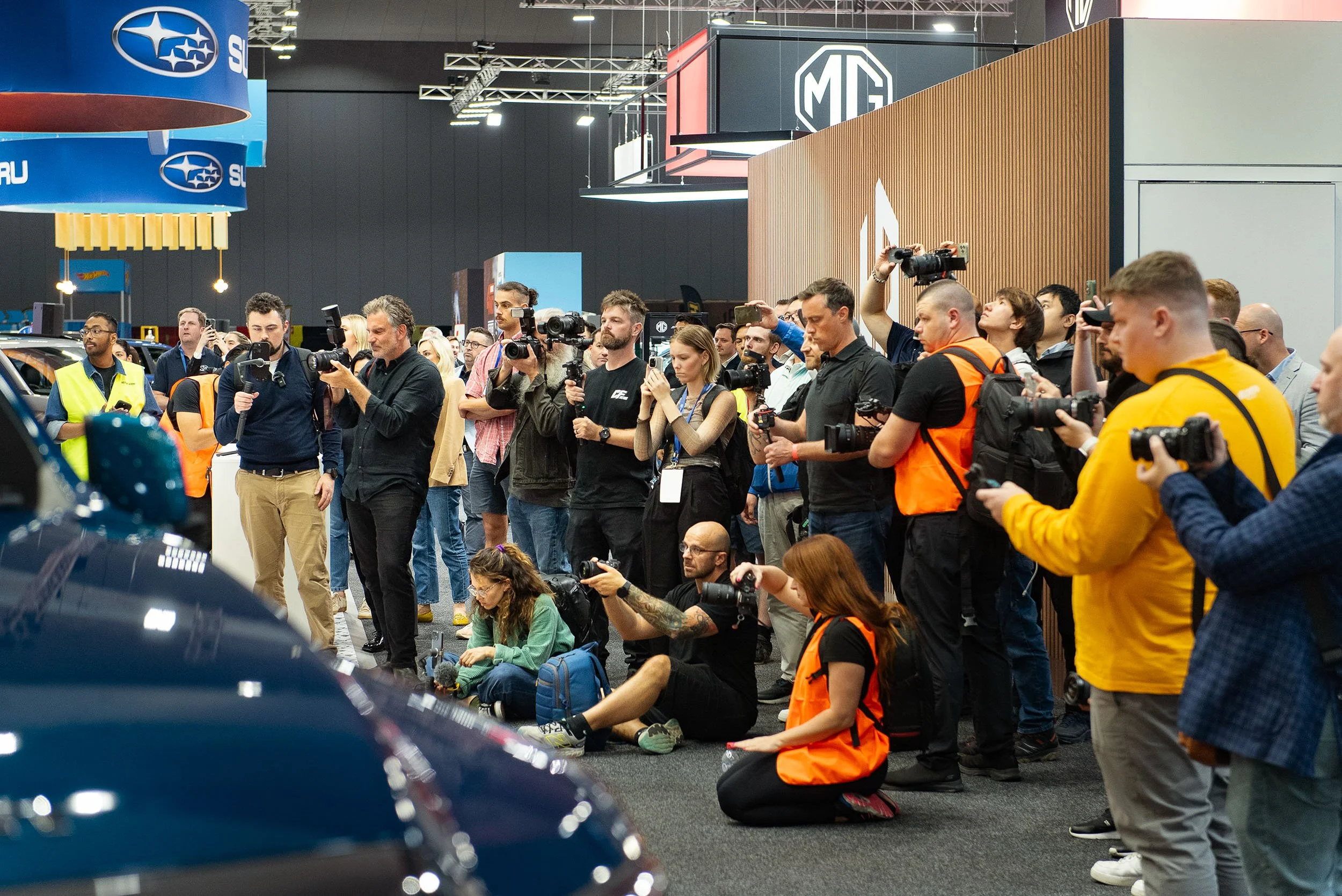 Media photographers covering a vehicle launch at MCEC Melbourne