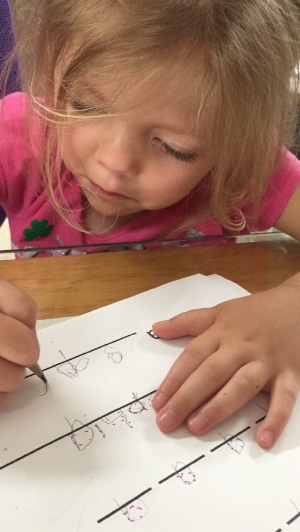 Her first attempt to write her whole name all by herself. Love the concentration!