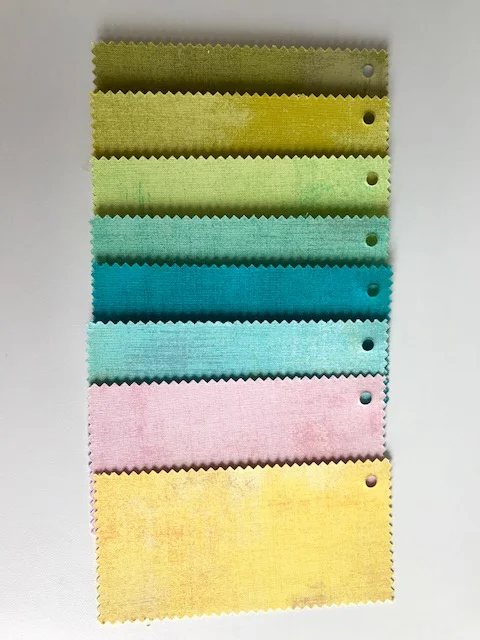 For my Blockheads 2018 Quilt Along I use Moda Grunge, colors from up to down: 30150 97 Kelp, 30150 66 Decadent, 30150 303 Key Lime, 30150 154 Aqua, 30150 228 Ocean, 30150 226 Pool, 30150 64 Duchesse and 30150 281 Sunflower.