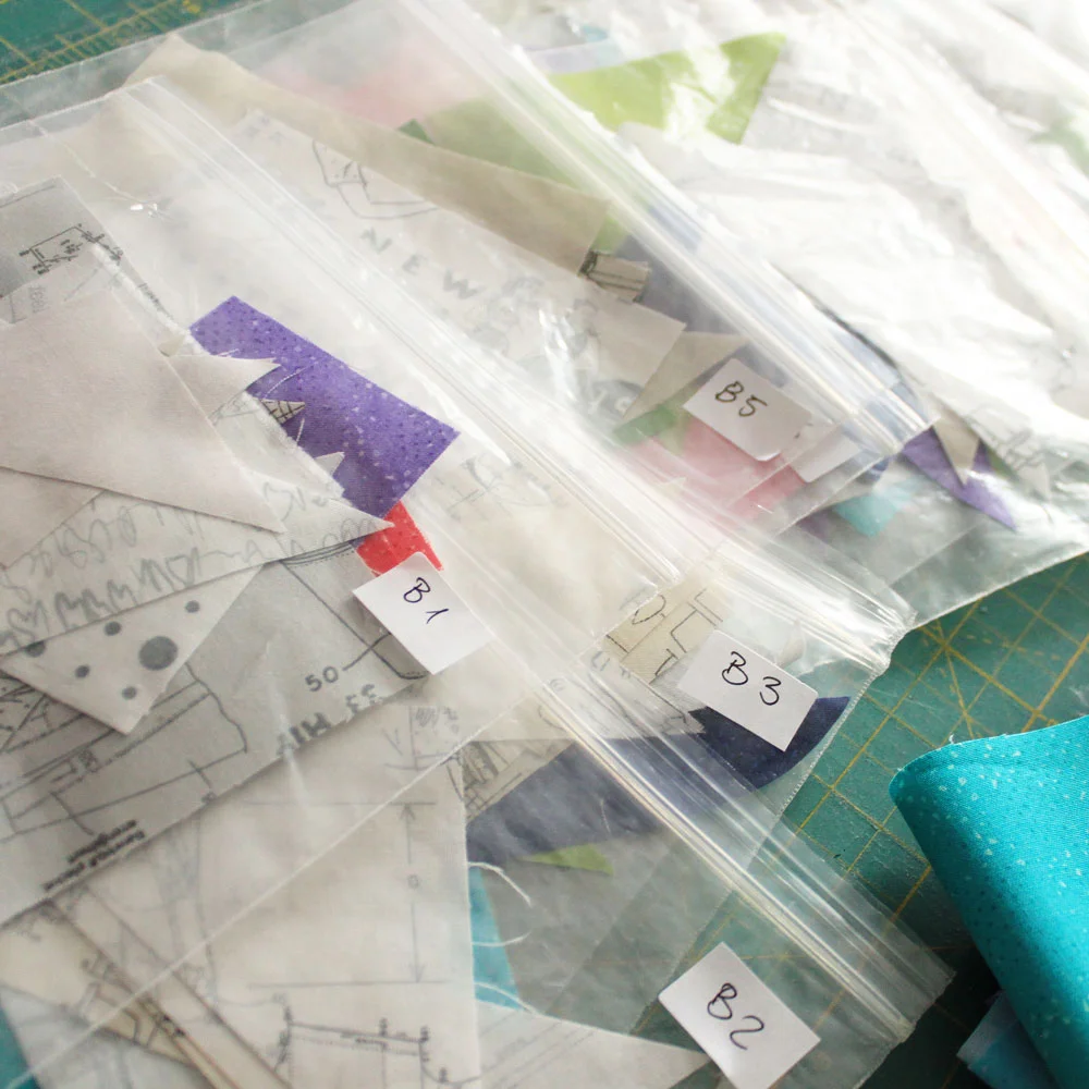 Organize your fabrics in clear bags. Use a bag of all needed pieces per block.