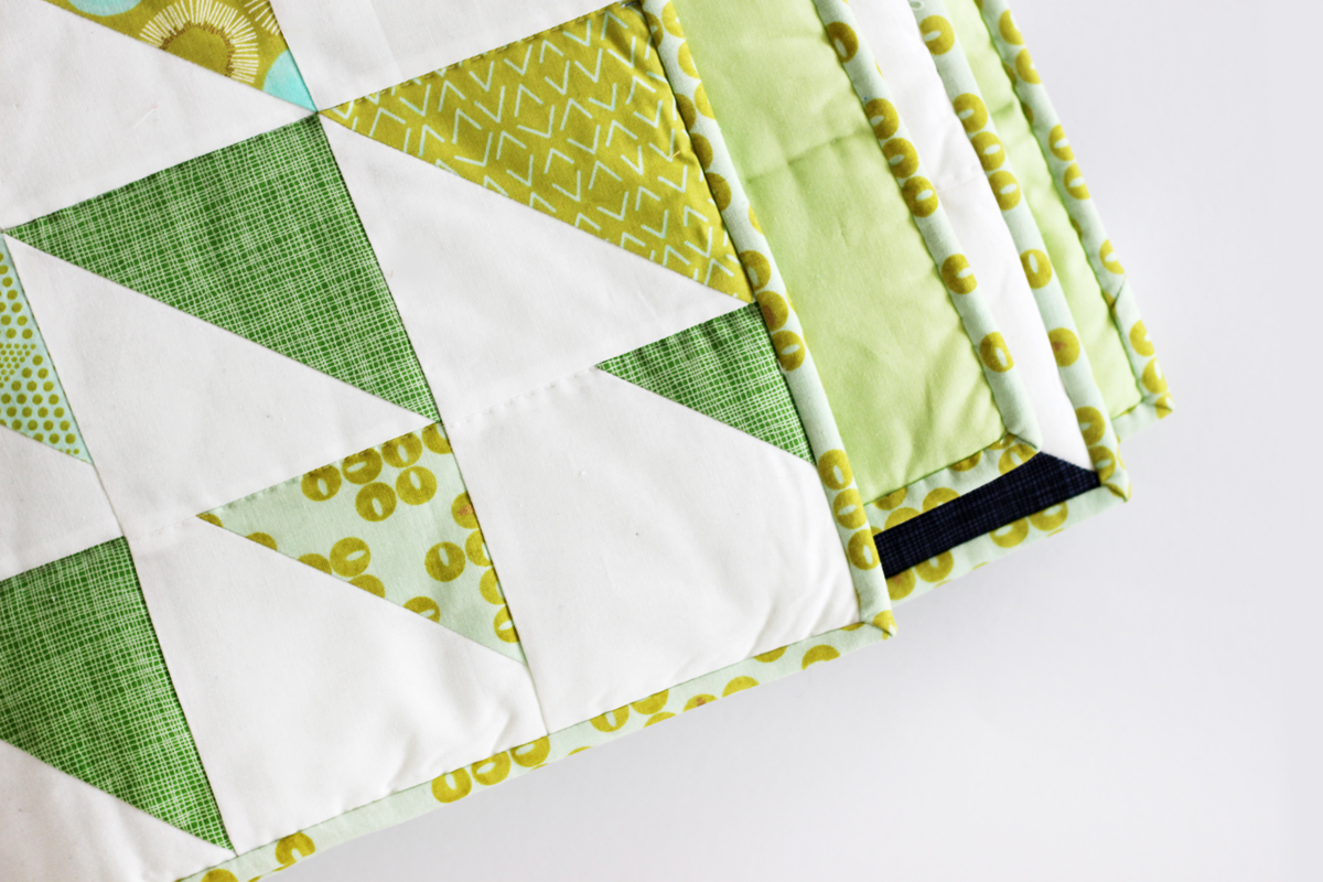Chic patterns, elegant gold accents and cool hues make Zen Chic’s Day in Paris fabric line a perfect match for Purl Soho’s Prism quilt free pattern.
