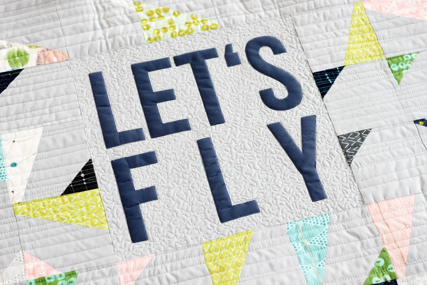 Let’s Fly, improvisational modern quilt pattern by Zen Chic, using Charm Packs from the collection Day in Paris by Zen Chic for Moda