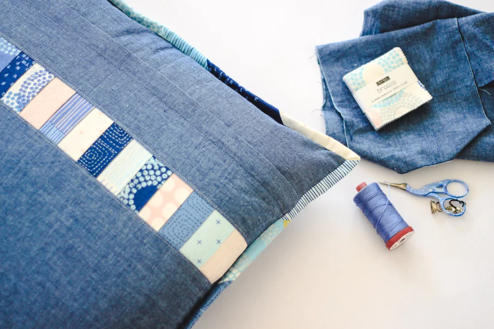 A charming accent pillow made with a mini charm pack of Zen Chic’s Breeze fabric collection.