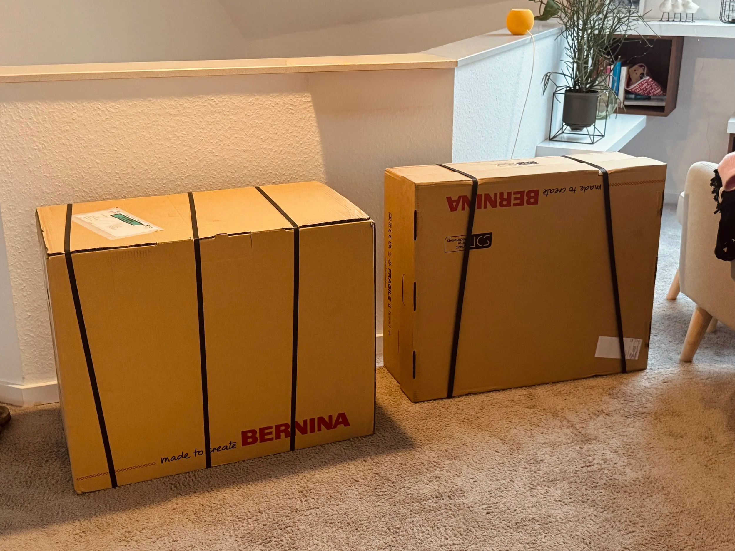 Two large delivery boxes with the new BERNINA 790 Ultra in the Zen Chic studio