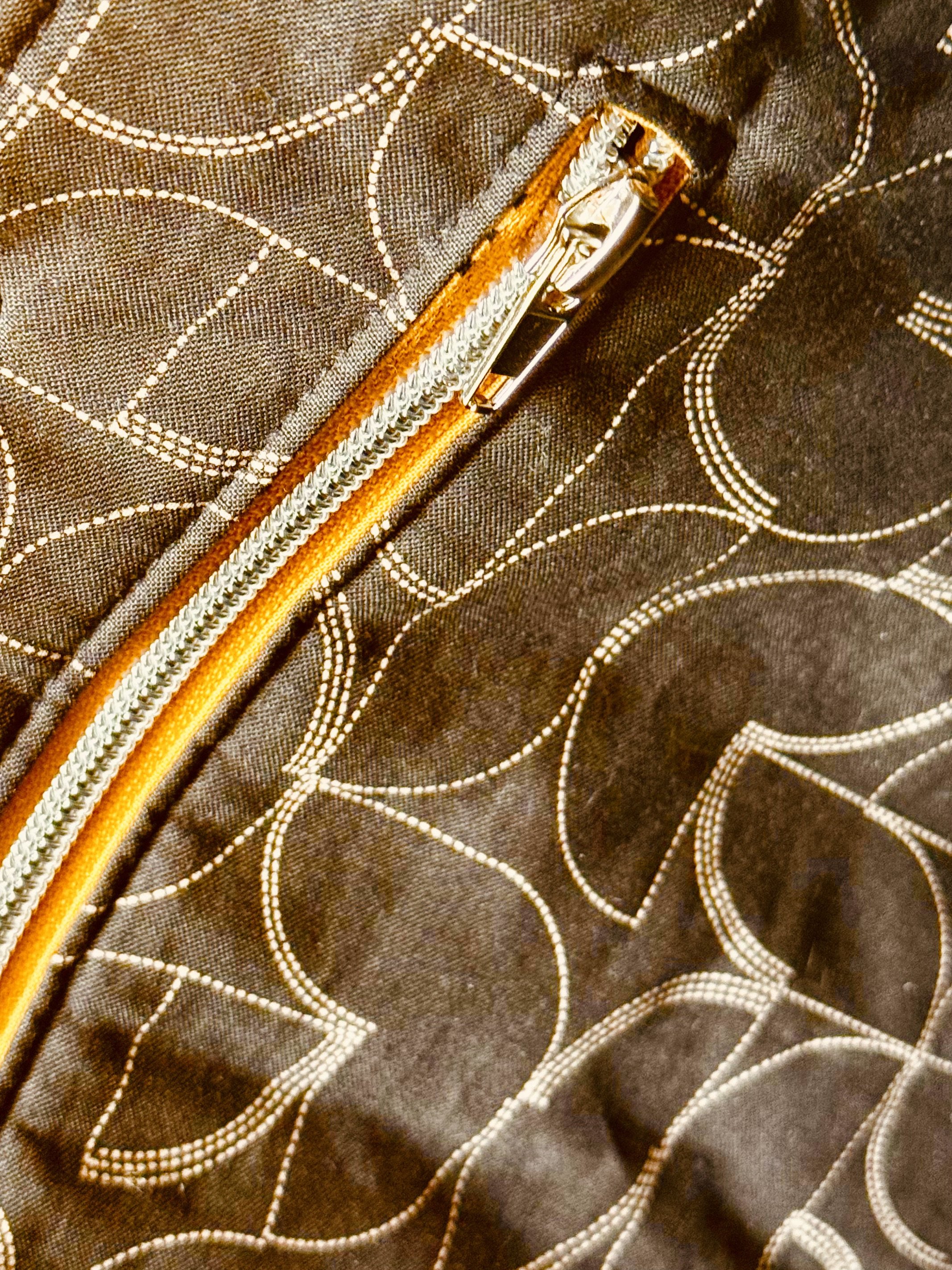 Open Sheridan Tote bag showing the lining, quilting and golden zipper coordinated with the MIRA fabric accents.