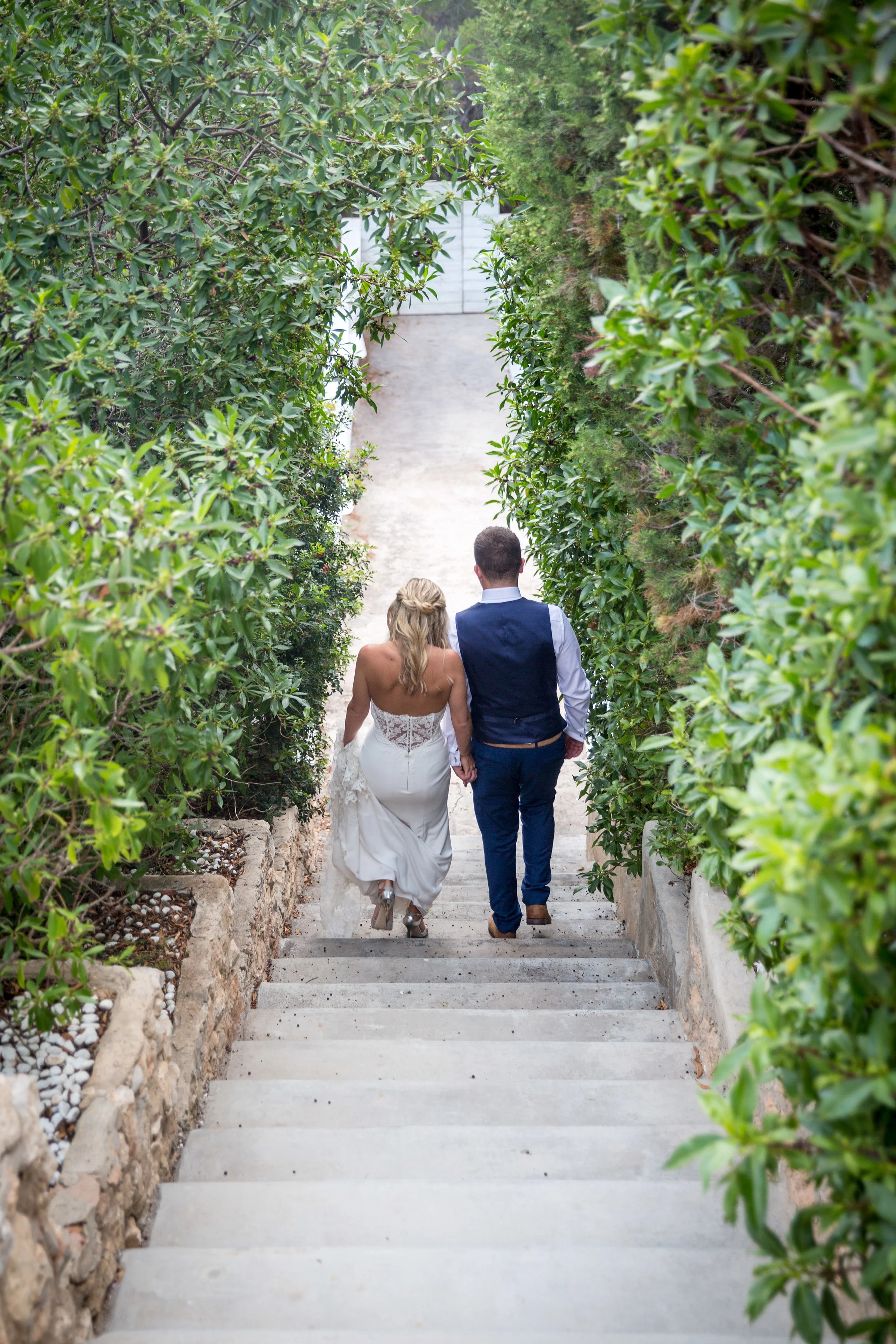Path to the beach. Wedding couple at Elixir Shore Club, Ibiza. Es Codolar. Photo by Matt Morgan.