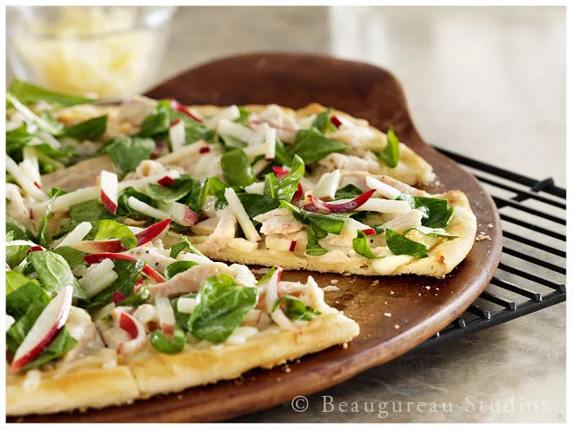 A unique White BBQ sauce accents this wonderful pizza.